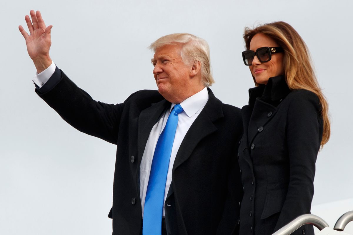 President-elect Donald Trump, accompanied by his wife Melania Trump, waves as they arrive at Andrews Air Force Base, Md., Thursday, Jan. 19, 2017, ahead of Friday's inauguration. (AP Photo/Evan Vucci) (AP)