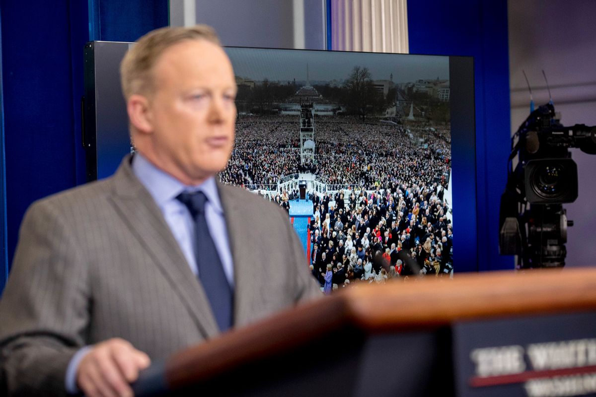 An image of the inauguration of President Donald Trump is displayed behind White House press secretary Sean Spicer as he speaks at the White House, Saturday, Jan. 21, 2017, in Washington.  (AP Photo/Andrew Harnik) (AP)