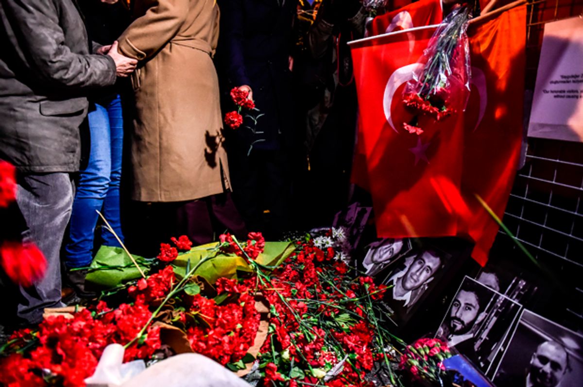 People lay flowers in front of the Reina nightclub on January 3, 2017 in Istanbul   (Getty/Yasin Akgul)