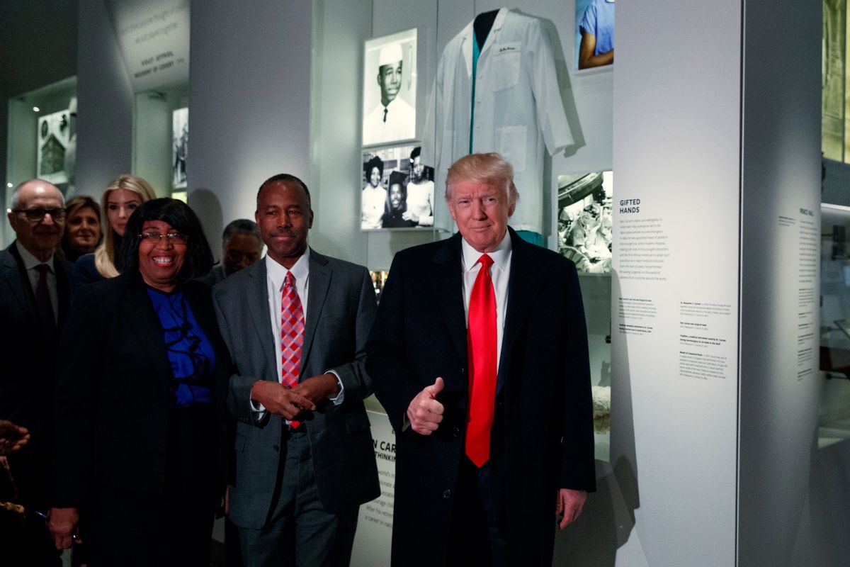 President Donald Trump gives a thumbs up during a tour of the National Museum of African American History and Culture with Housing and Urban Development Secretary-designate Dr. Ben Carson and his wife Candy Carson, Tuesday, Feb. 21, 2017, in Washington. (AP Photo/Evan Vucci) (AP)