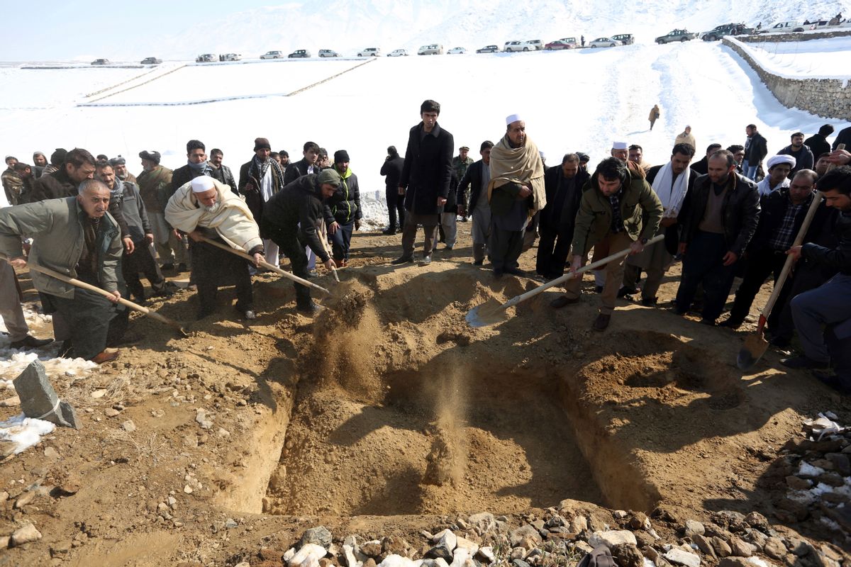 Men bury a victim of a suicide attack on the Supreme Court in Kabul, Afghanistan, Wednesday, Feb. 8, 2017.  (AP)