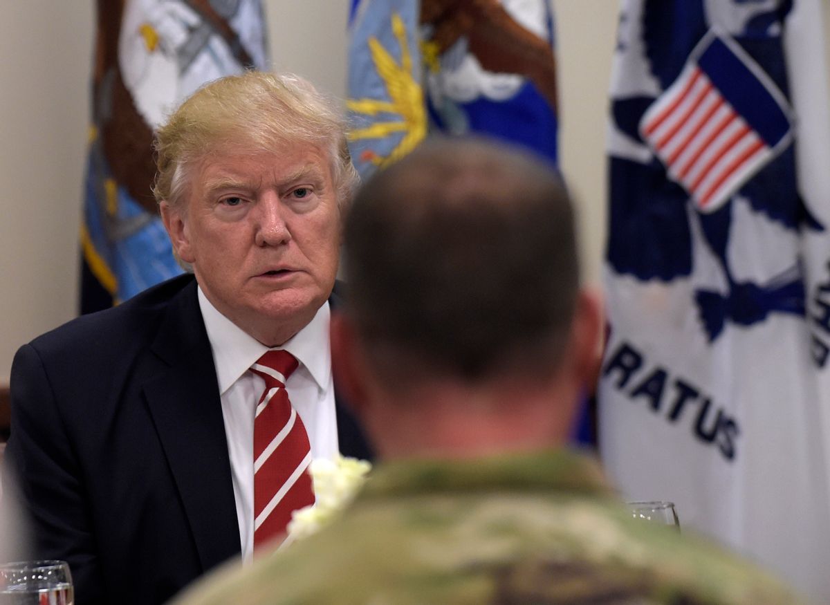 President Donald Trump has lunch with troops while visiting U.S. Central Command and U.S. Special Operations Command at MacDill Air Force Base, Fla., Monday, Feb. 6, 2017. Trump, who spent the weekend at Mar-a-Lago, stopped for a visit to the headquarters before returning to Washington. (AP Photo/Susan Walsh) (AP)
