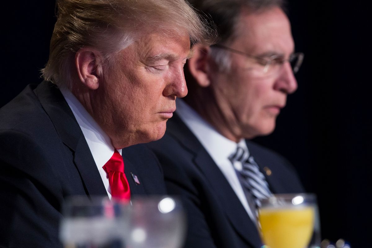 FILE - In this Feb. 2, 2017, file photo, President Donald Trump and Sen. John Boozman, R-Ark., pause during the National Prayer Breakfast in Washington. When Trump spoke to the National Prayer Breakfast this month, he underscored his vow to defend the religious rights of the conservative Christians who helped propel him to power. (AP Photo/Evan Vucci, File) (AP)