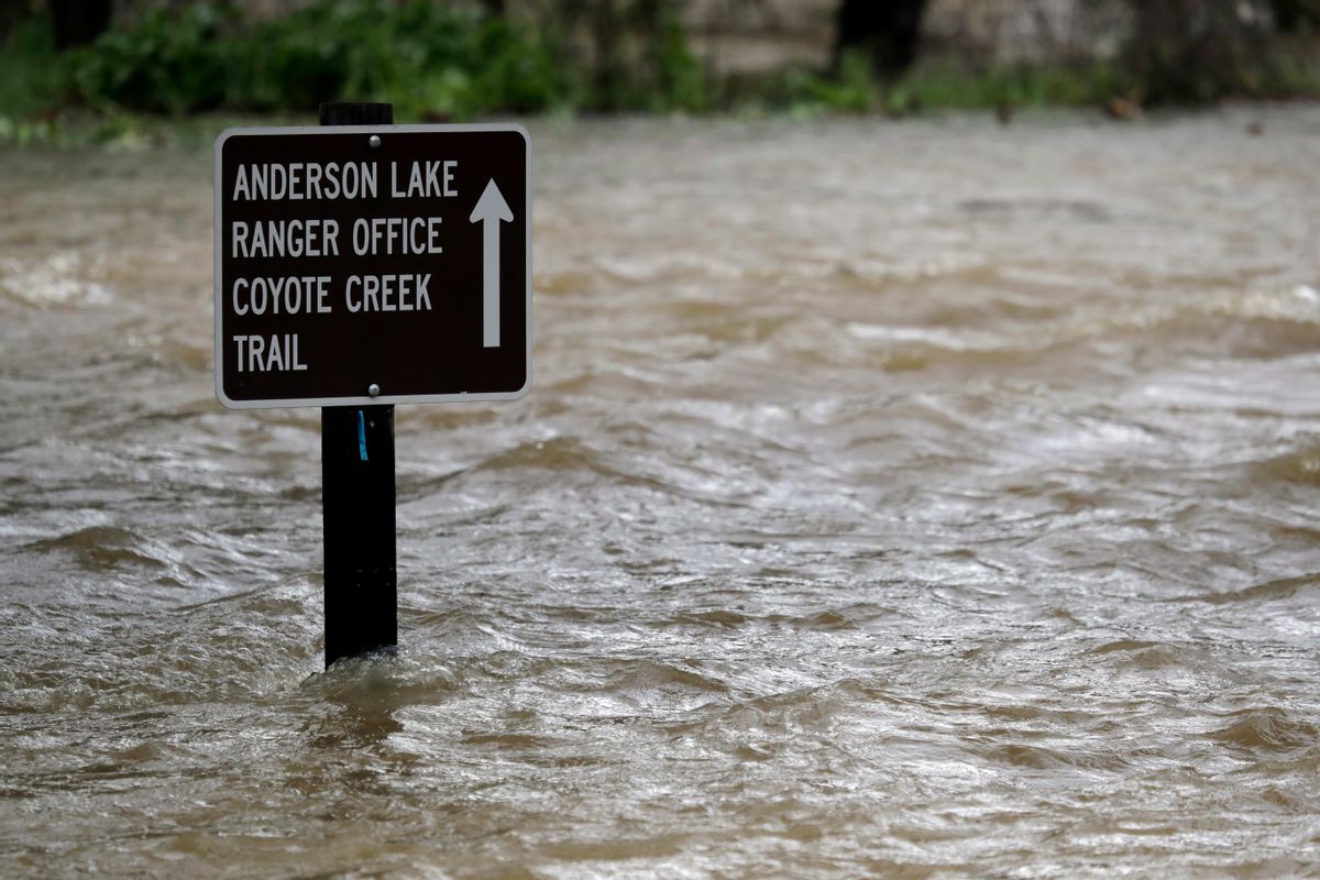 A sign is submerged in the water from Coyote Creek Tuesday, Feb. 21, 2017, in Morgan Hill, Calif. Rains have saturated once-drought stricken California but have created chaos for residents hit hard by the storms. The latest downpours swelled waterways to flood levels and left about half the state under flood, wind and snow advisories. () (AP Photo/Marcio Jose Sanchez)
