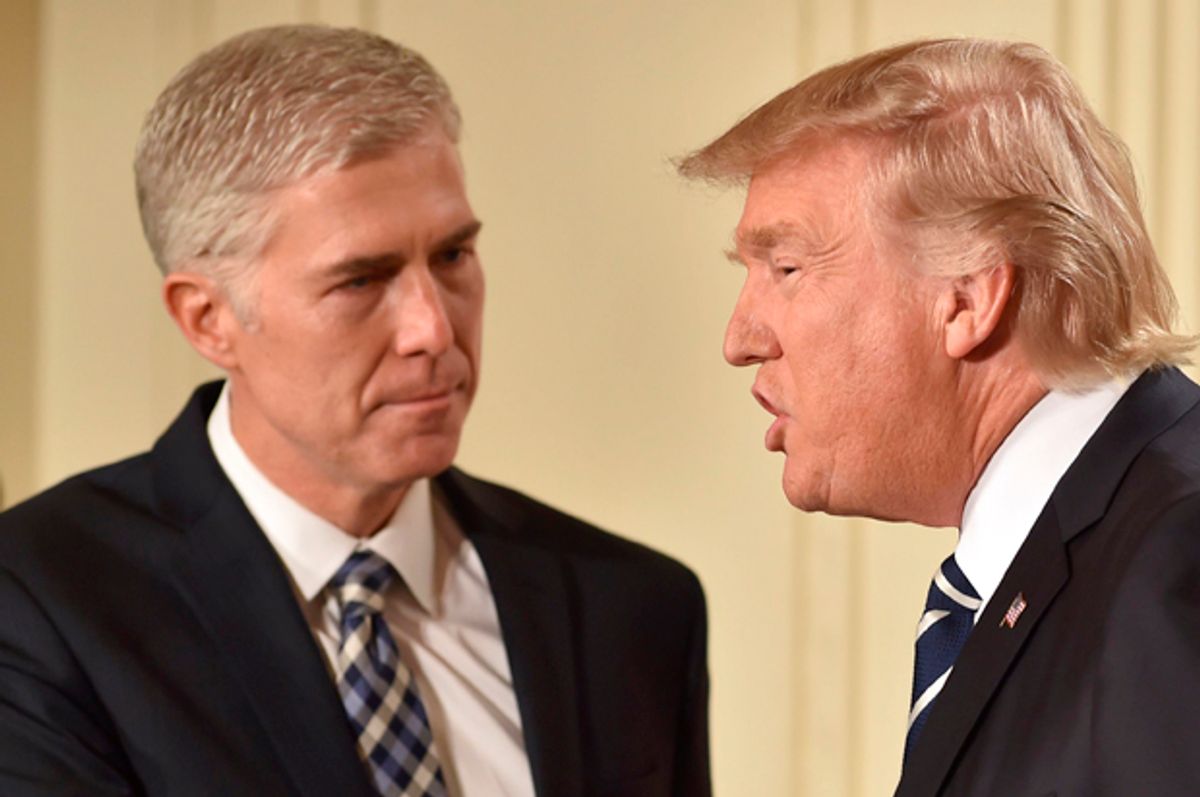 Neil Gorsuch shakes hands with Donald Trump after he was nominated for the Supreme Court, at the White House in Washington, DC, on January 31, 2017.   (Getty/Nicholas Kamm)