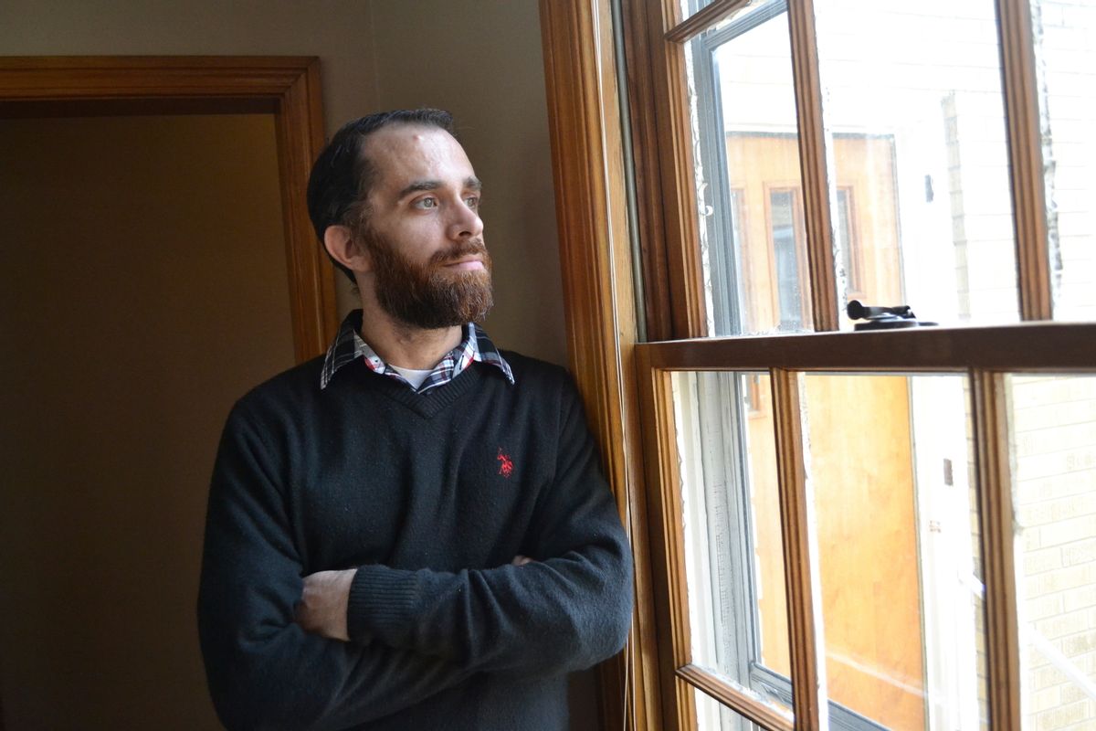 In a Wednesday, Feb. 1, 2017 photo, Tyler Witten peers through a window at the Sanibel House, a residential addiction center in Catlettsburg, Ky. Witten, a former opioid addict, has gone through an addiction program and now works as a weekend staffer at the house. The house and other centers are operated by Addiction Recovery Care, which is seeing many new patients who are covered under Kentuckys Medicaid expansion as part of the Affordable Care Act. (AP Photo/Dylan Lovan) (AP)