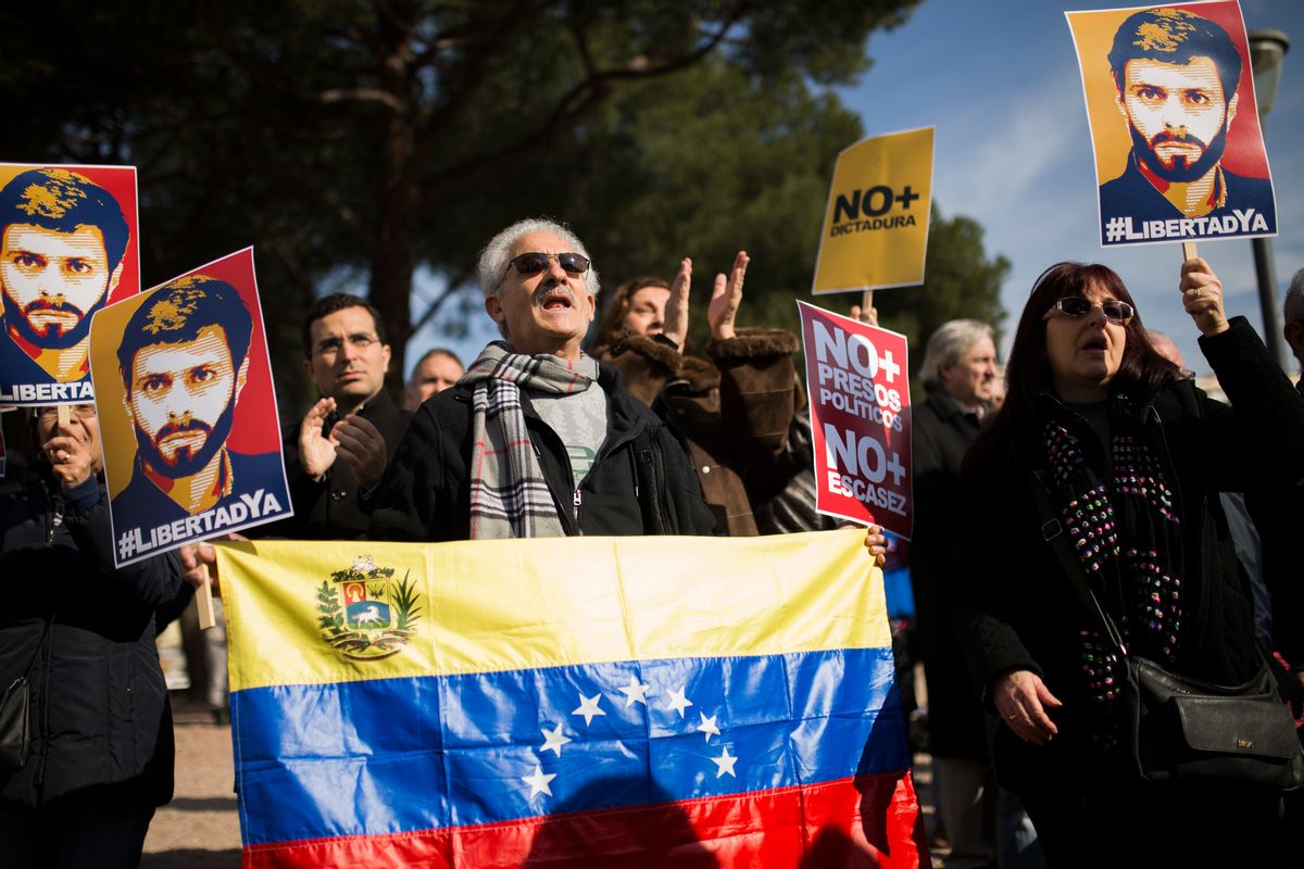 Protestors, some holding posters with the image of Venezuela's jailed opposition leader Leopoldo Lopez, shout slogans during a demonstration demanding the release of Lopez and other jailed opposition leaders, in Madrid, Saturday, Feb. 18, 2017. Posters read in Spanish: "Freedom Now", "No More Dictatorship", "No More Political Prisoners" and "No More Impoverishment". (AP Photo/Francisco Seco) (AP)