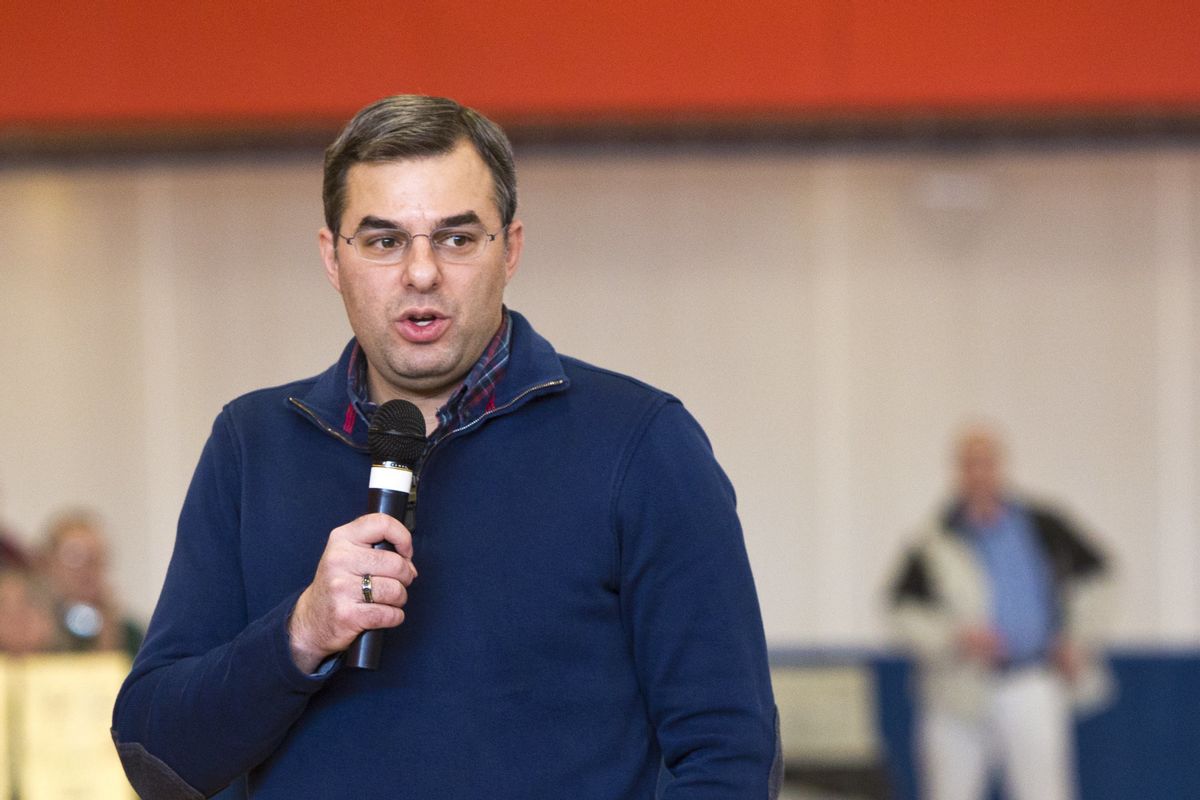 U.S Rep. Justin Amash, R-Cascade Township, speaks to the audience during a town hall meeting on Thursday, Feb. 23, 2017 at the Full Blast Recreation Center in Battle Creek, Mich.   Amash is embracing the town halls that many of his Republican counterparts in Congress have avoided as people lash out at President Donald Trump’s early actions and the planned repeal of the federal health care law.   (Carly Geraci/Kalamazoo Gazette-MLive Media Group via AP) (AP)