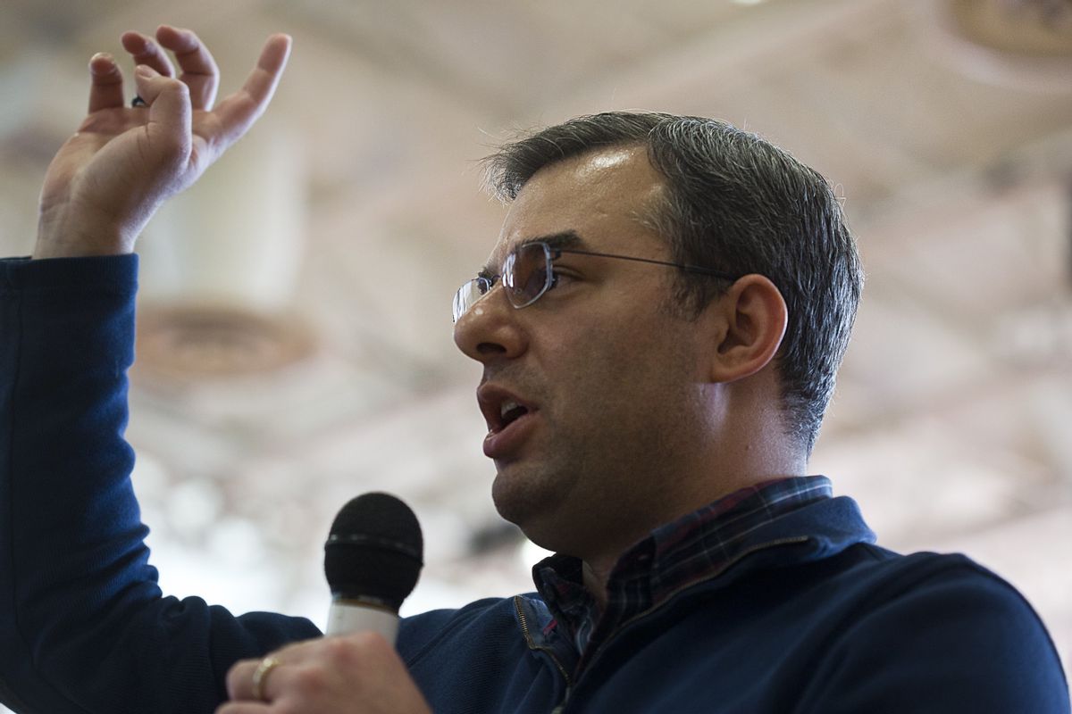 U.S Rep. Justin Amash, R-Cascade Township, speaks to the audience during a town hall meeting on Thursday, Feb. 23, 2017 at the Full Blast Recreation Center in Battle Creek, Mich.   Amash is embracing the town halls that many of his Republican counterparts in Congress have avoided as people lash out at President Donald Trump’s early actions and the planned repeal of the federal health care law.   (Carly Geraci/Kalamazoo Gazette-MLive Media Group via AP) (AP)