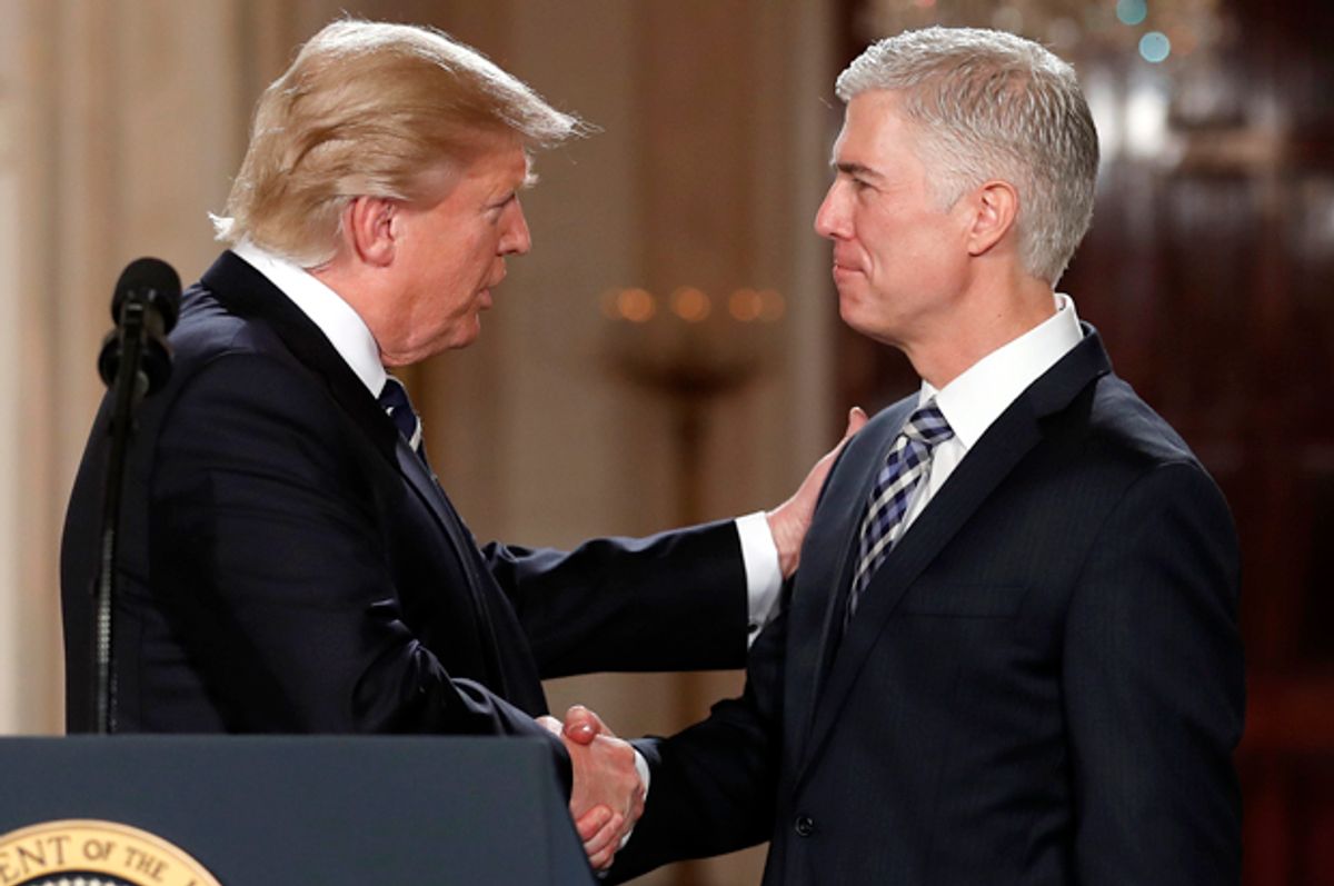 Donald Trump shakes hands with Neil Gorsuch, his choice for Supreme Court Justice, at the White House, Jan. 31, 2017.    (AP/Carolyn Kaster)