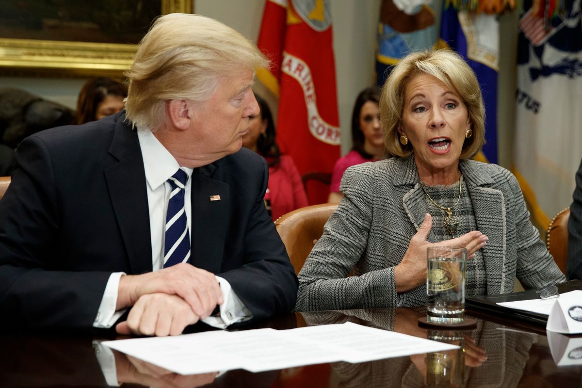 President Donald Trump listens as Education Secretary Betsy DeVos speaks during a meeting with parents and teachers, Tuesday, Feb. 14, 2017, in the Roosevelt Room of the White House in Washington. (AP Photo/Evan Vucci) (AP)