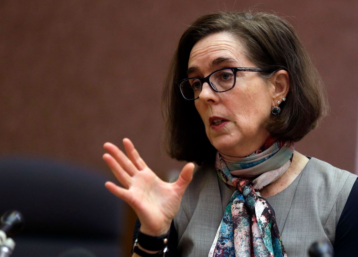 In this Thursday, Jan. 26, 2017, photo, Oregon Gov. Kate Brown speaks to media representatives in Salem, Ore. President Donald Trump's promised crackdown on "sanctuary cities" has triggered divergent actions from blue and red states: Some are moving to follow his order and others are breaking with the U.S. government to protect immigrants in the country illegally. Oregon pioneered statewide sanctuary in a 1987 law. Brown said she will enforce that law, saying, "They take care of our children and they take care of our seniors, and I want to make sure they feel welcome in Oregon." (AP Photo/Don Ryan) (AP)