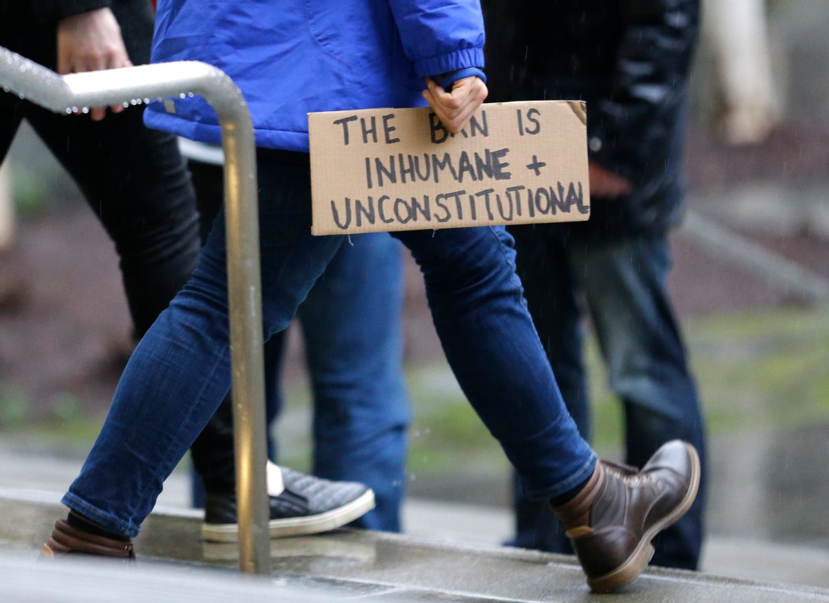 A person walks away from the federal courthouse in Seattle  (AP)