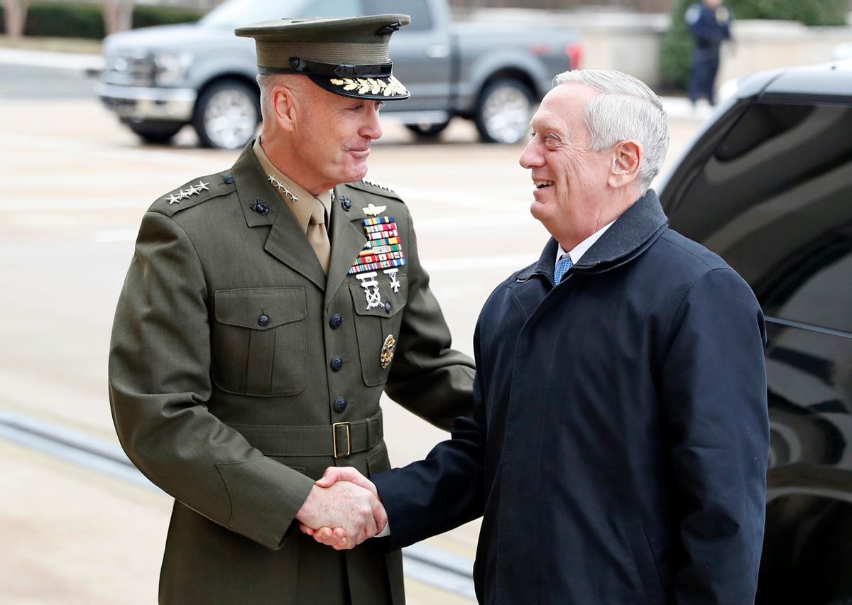 FILE - In this Jan. 21, 2017 file photo, Joint Chiefs Chairman Gen. Joseph Dunford greets Defense Secretary Jimn Mattis at the Pentagon. A new military strategy to meet President Donald Trump’s demand “to obliterate” the Islamic State group is likely to deepen U.S. military involvement in Syria, possibly with more ground troops, even as the current U.S. approach in Iraq appears to be working and will require fewer changes. Dunford said Feb. 23 that the strategy will take aim not just at the Islamic State but at al-Qaida and other extremist organizations in the Middle East and beyond whose goal is to attack the United States. He emphasized that it would not rest mainly on military might. (AP Photo/Alex Brandon, File) (AP)
