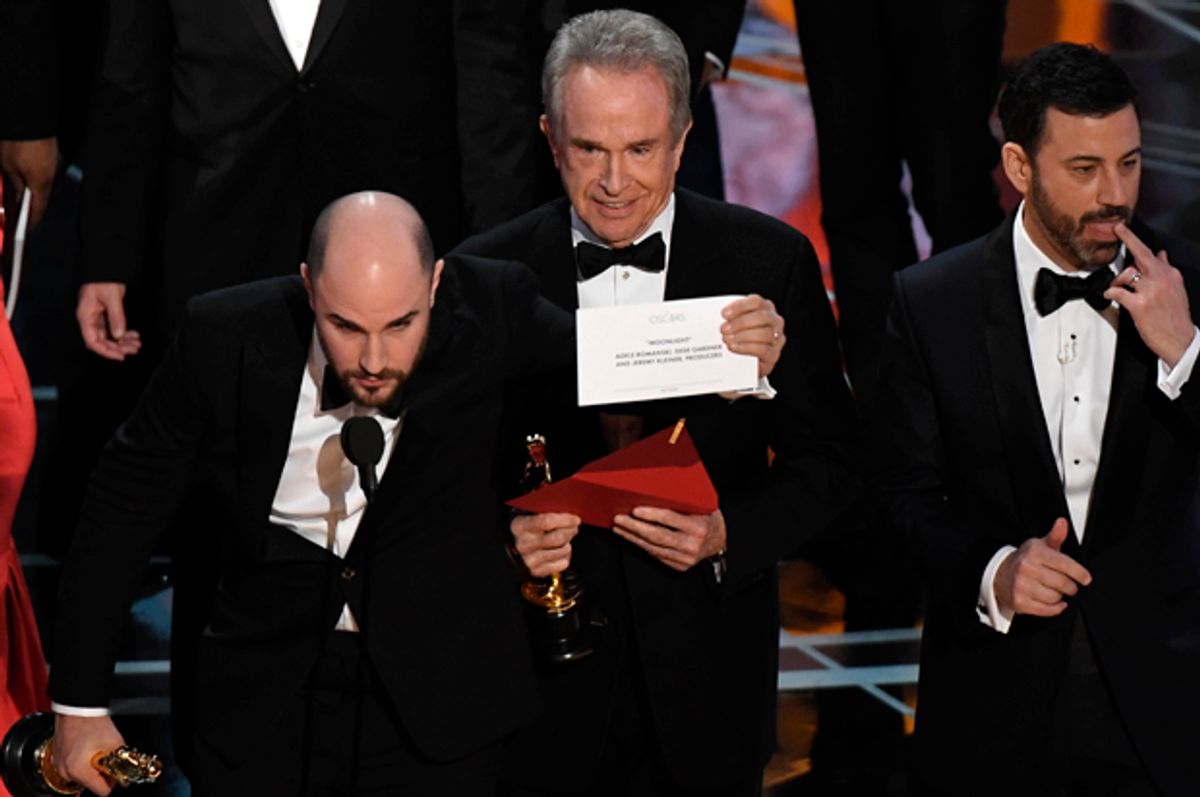 Warren Beatty shows the card reading Best Film 'Moonlight" after mistakingly reading "La La Land" initially at the 89th Oscars on February 26, 2017 in Hollywood, California.   (Getty/Mark Ralston)