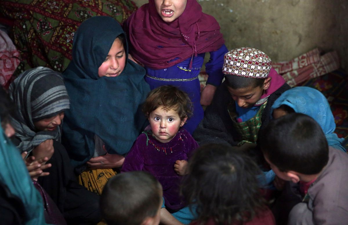 In this Sunday, March 19, 2017 photo, children play in their home in Kabul, Afghanistan. An aid group said Wednesday, March 22, 2017 that nearly a third of all children in war-torn Afghanistan are unable to attend school, leaving them at increased risk of child labor, recruitment by armed groups, early marriage and other forms of exploitation. (AP Photos/Massoud Hossaini) (AP)