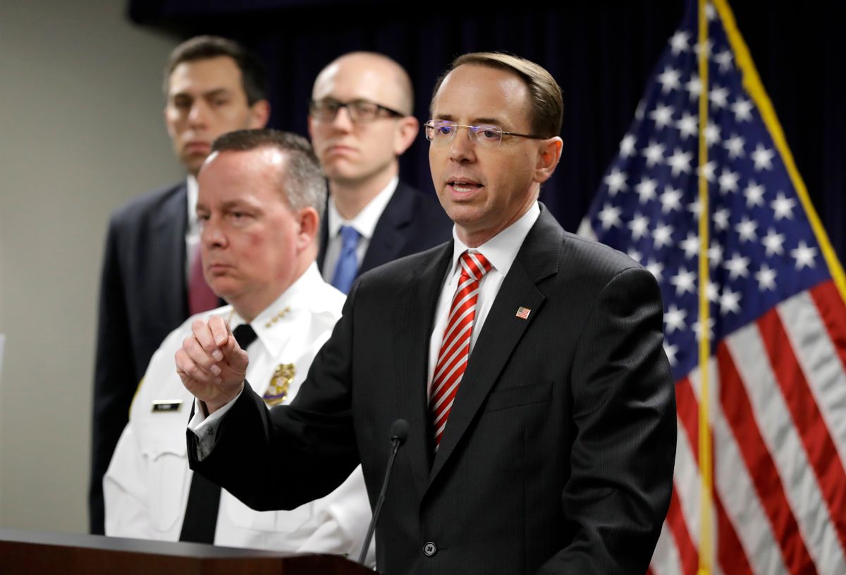 U.S. Attorney for the District of Maryland Rod J. Rosenstein, right, speaks at a news conference in Baltimore, Wednesday, March 1, 2017, to announce that seven Baltimore police officers who worked on a firearms crime task force are facing charges of stealing money, property and narcotics from people over two years. Standing alongside Rosenstein is Baltimore Police Department Commissioner Kevin Davis. (AP Photo/Patrick Semansky) (AP)