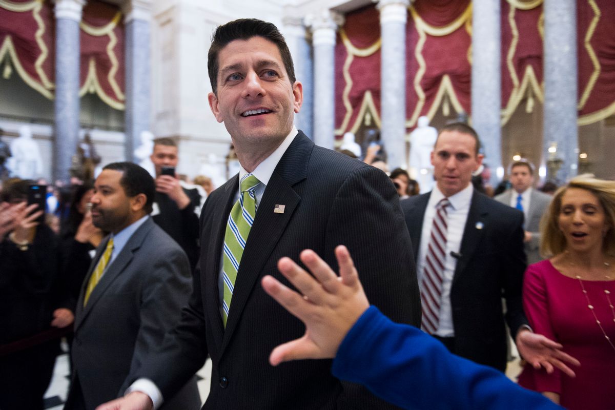 House Speaker Paul Ryan of Wisc., passes a waving tourist as he walks from the House Chamber to his office on Capitol Hill in Washington, Friday, March 24, 2017, as the House nears a vote on their health care overhaul. (AP Photo/Cliff Owen) (AP)