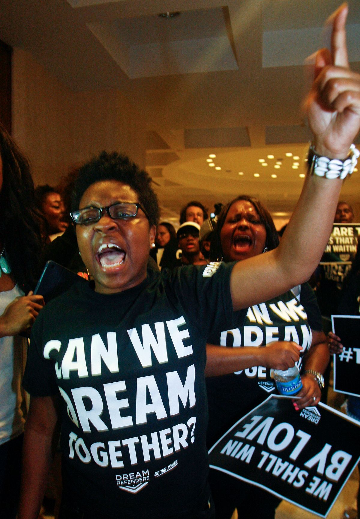 FILE – In this July 26, 2013, file photo, Charlene Carruthers, representing the Black Youth Project 100 in Chicago, protests outside Florida Gov. Rick Scott's office at the Capitol in Tallahassee, Fla. A cluster of Black Lives Matter groups, including the Black Youth Project 100, and an organization leading the push for a $15-an-hour wage, Fight for $15, are joining forces for their first national joint action, planning "Fight Racism, Raise Pay" protests on the 49th anniversary of the Rev. Martin Luther King Jr.'s assassination, April 4, 2017, in two dozen cities including Chicago. (AP Photo/Phil Sears, File) (AP)