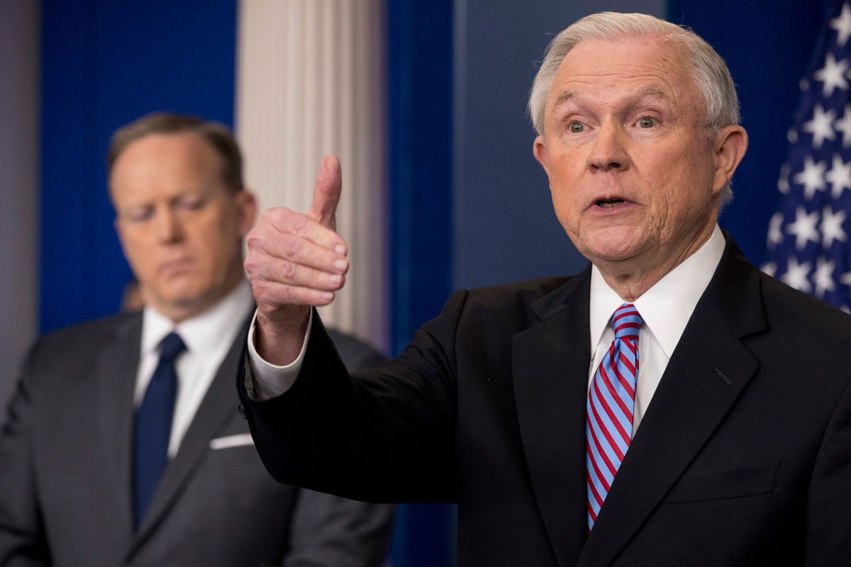 Attorney General Jeff Sessions, right, accompanied by White House press secretary Sean Spicer, talks to the media during the daily press briefing at the White House in Washington, Monday, March 27, 2017. (AP Photo/Andrew Harnik) (AP)