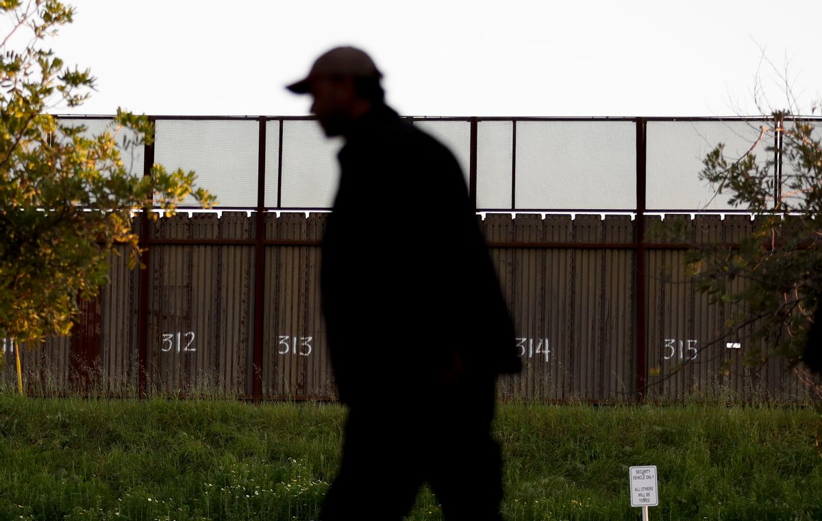 A man passes a section of border fencing that separates Tijuana, Mexico, with San Diego on Tuesday, Feb. 28, 2017, in San Diego. President Donald Trump, signaling a potential shift on a signature issue, indicated Tuesday that he's open to immigration legislation that would give legal status to some people living in the U.S. illegally and provide a pathway to citizenship to those brought to the U.S. illegally as children. (AP Photo/Gregory Bull) (AP)