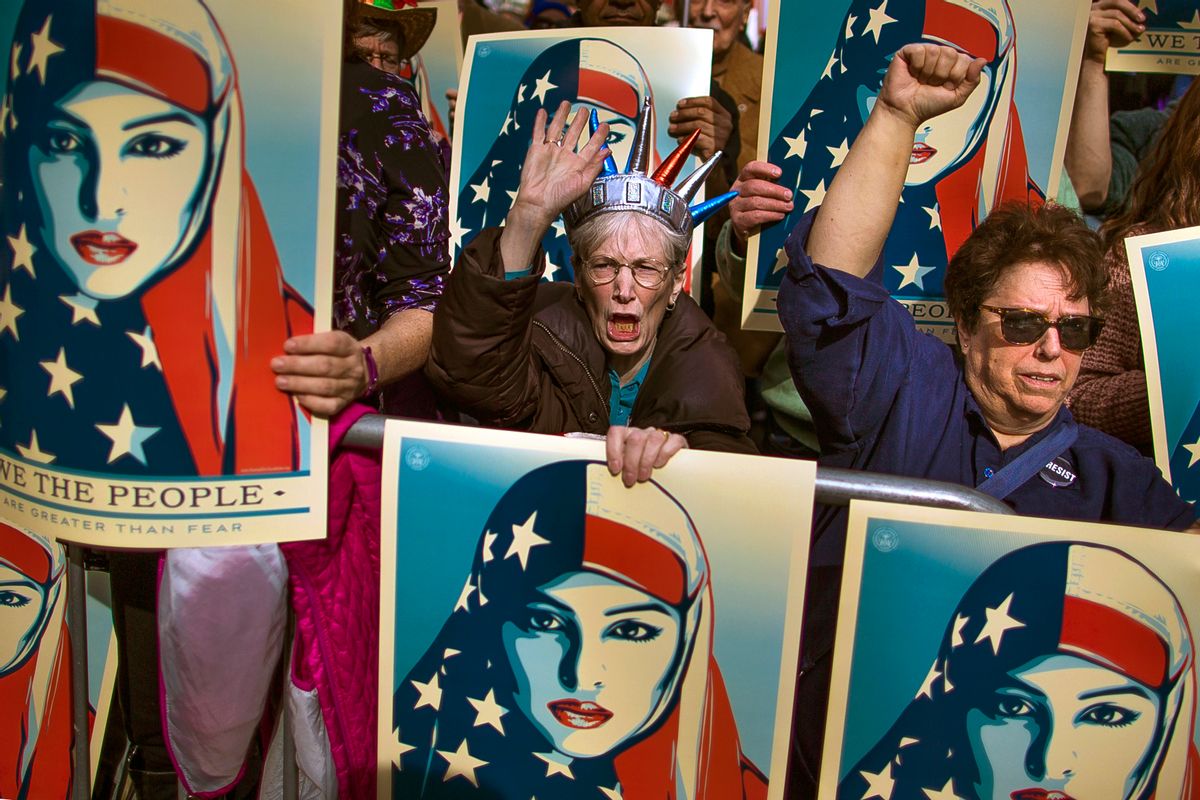 In this Feb. 19, 2017, file photo, people carry posters during a rally against President Donald Trump's executive order banning travel from seven Muslim-majority nations, in New York's Times Square. Trump’s travel ban has been frozen by the courts, but the White House has promised a new executive order that officials say will address concerns raised by judges that have put the policy on hold.
The first order was met by legal challenges, confusion at airports worldwide and mass protests, but the White House has forecast smoother sailing the second time around.  () (AP Photo/Andres Kudacki)