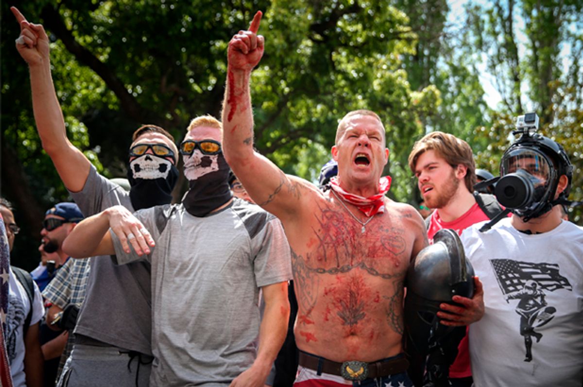 BERKELEY, CA - APRIL 15: Trump supporters face off with protesters at a "Patriots Day" free speech rally on April 15, 2017 in Berkeley, California. More than a dozen people were arrested after fistfights broke out at a park where supporters and opponents of President Trump had gathered. (Photo by Elijah Nouvelage/Getty Images) (Getty Images)