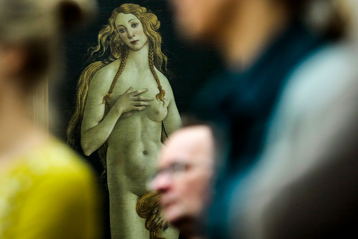 In this Thursday, Jan. 15, 2015 file photo people stand in front of the 'Venus' by Italian painter Sandro Botticelli during a news conference about the planned exhibition 'The Botticelli Renaissance' in Berlin. (AP Photo/Markus Schreiber)