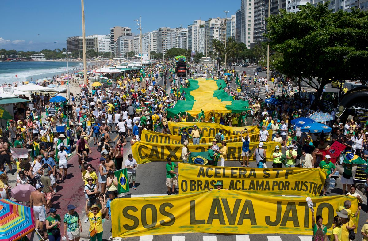 In this March 26, 2017, file photo, people march against corruption and in support of the Car Wash investigation on Copacabana beach, in Rio de Janeiro, Brazil. Three years since the so-called Car Wash investigation began, dozens of the country's elite have been jailed, and there is no end in sight. The investigation has expanded, both within Brazil and to several Latin American countries, with daily revelations about accusations of wrongdoing that threaten many political leaders. (AP Photo/Silvia Izquierdo) (AP)
