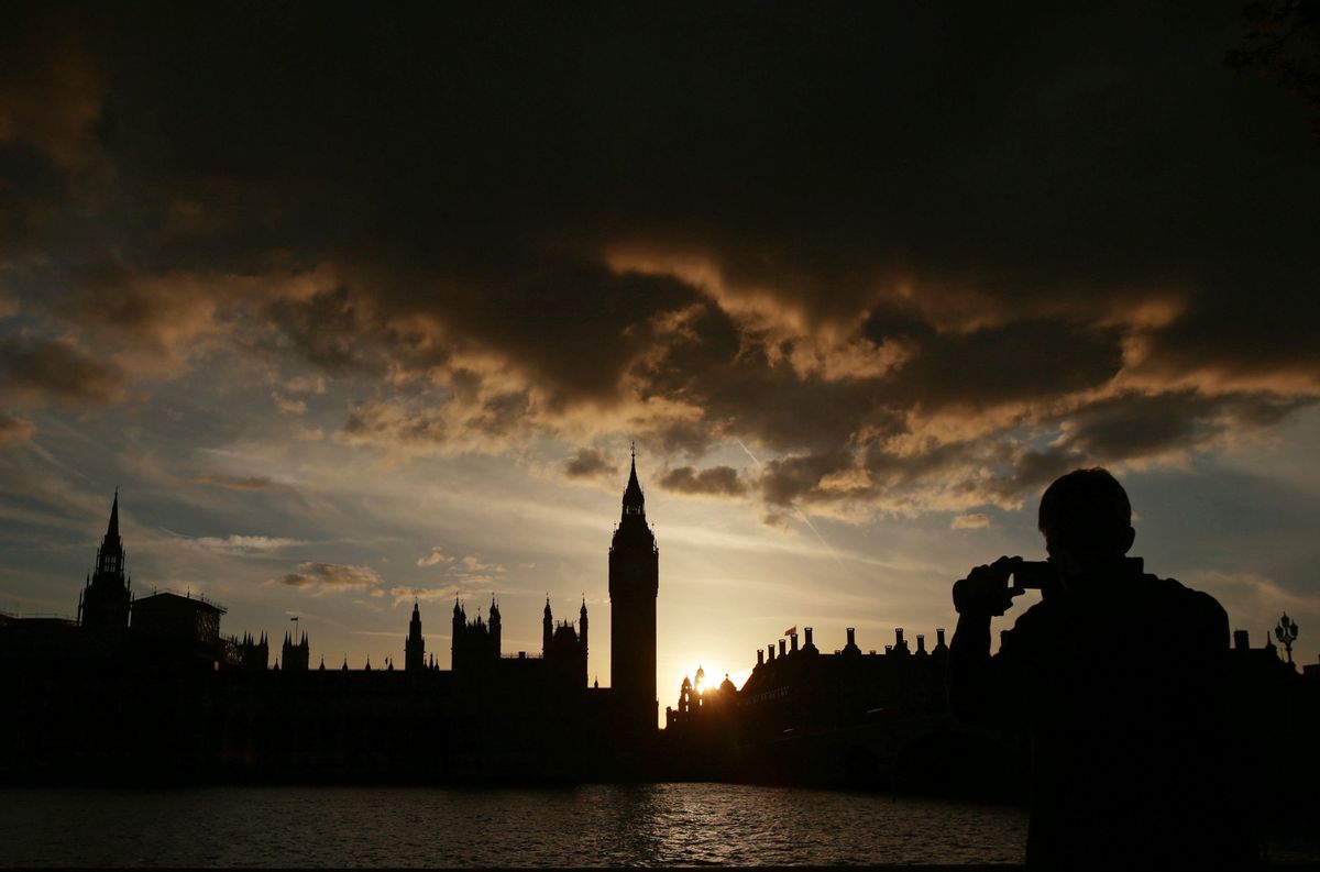 A silhouette of the Houses of Parliament and Elizabeth Tower containing Big Ben, centre, at dusk, in Westminster, London, Tuesday April 18, 2017.  (Yui Mok/PA via AP)
