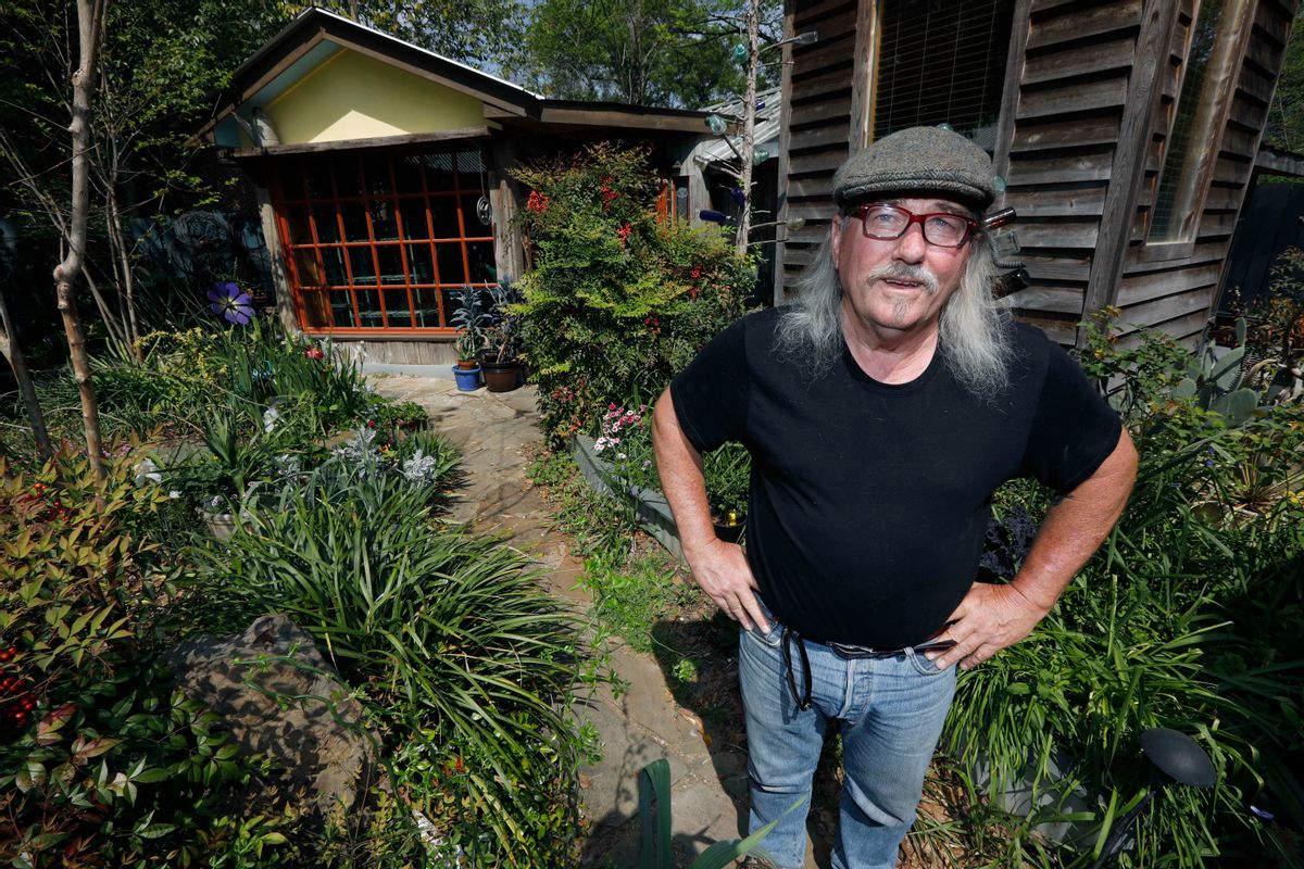In this March 22, 2017 photograph,"Gestalt Gardener," horticulturalist Felder Rushing stands in the midst of his wildflower and herb garden at his Jackson, Miss., home. The "Gestalt Gardner" program is one of Mississippi Public President Donald Trump’s proposal to erase federal support for public broadcasting would reach far into rural America.   (AP Photo/Rogelio V. Solis) (AP)