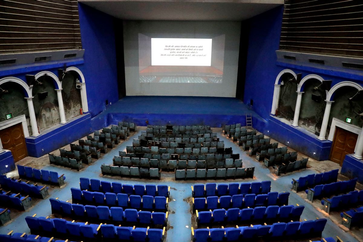 This Thursday, March 30, 2017 photo shows an overview of the colonial era Regal Theater in New Delhi, India. The Indian capital's iconic theater signed off on Thursday night after more than eight decades with nearly 600 movie buffs cheering a 1964 Bollywood classic at a final screening. It's expected to make way for a multiplex from a single screen. () (AP Photo/Manish Swarup)