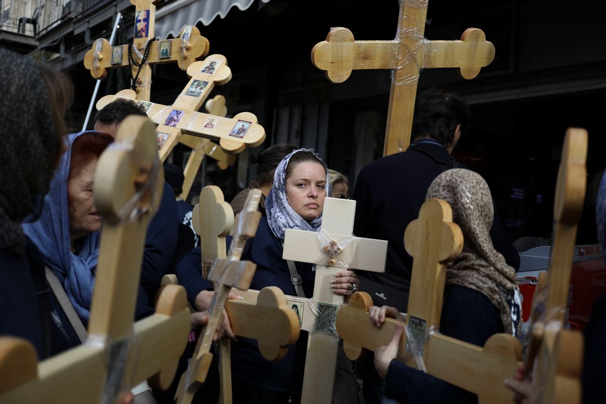 Christian pilgrims attend Good Friday procession in Jerusalem Friday, April 14, 2017. Good Friday is a Christian holiday which marks the crucifixion of Jesus Christ and his death. (AP Photo/Dan Baliltyl) (AP)