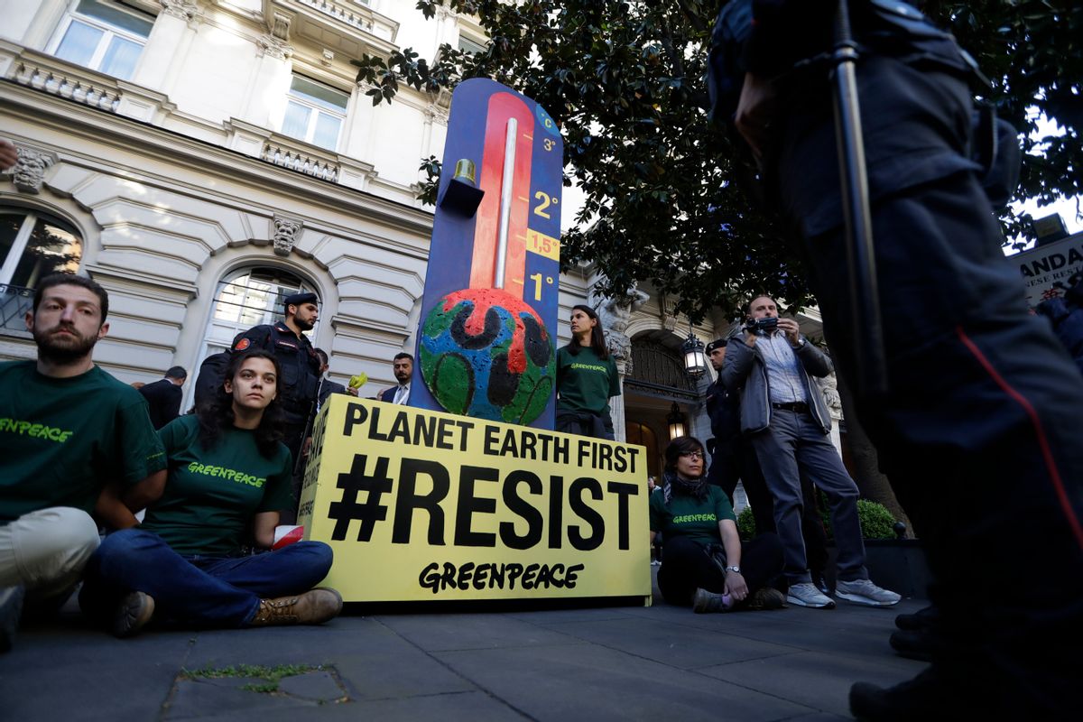 GreenPeace activists demonstrate outside a hotel hosting a G7 Energy meeting, attended also by United States Energy Secretary Rick Perry, in Rome. Monday, April 10, 2017. (AP Photo/Alessandra Tarantino) (AP)