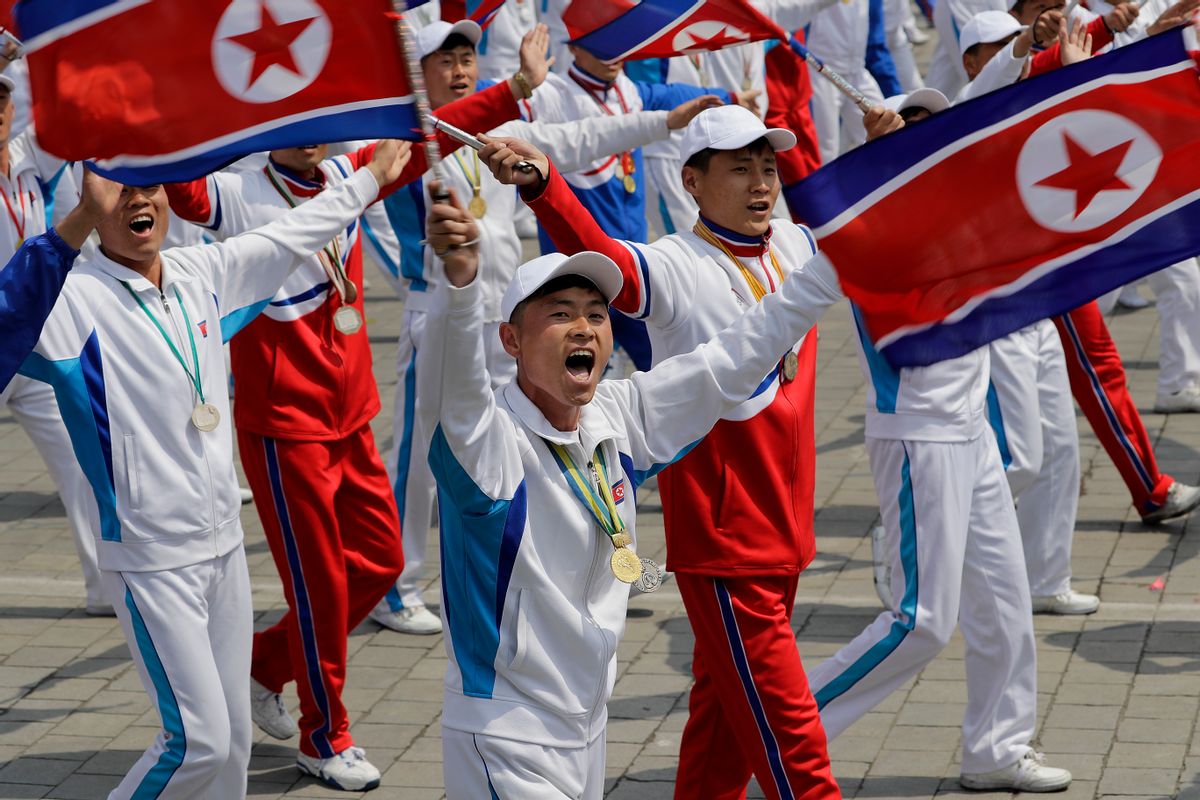 North Korean men and women dressed to represent athletes march across Kim Il Sung Square during a military parade on Saturday, April 15, 2017, in Pyongyang, North Korea to celebrate the 105th birth anniversary of Kim Il Sung, the country's late founder and grandfather of current ruler Kim Jong Un. (AP Photo/Wong Maye-E) (AP Photo/Wong Maye-E)