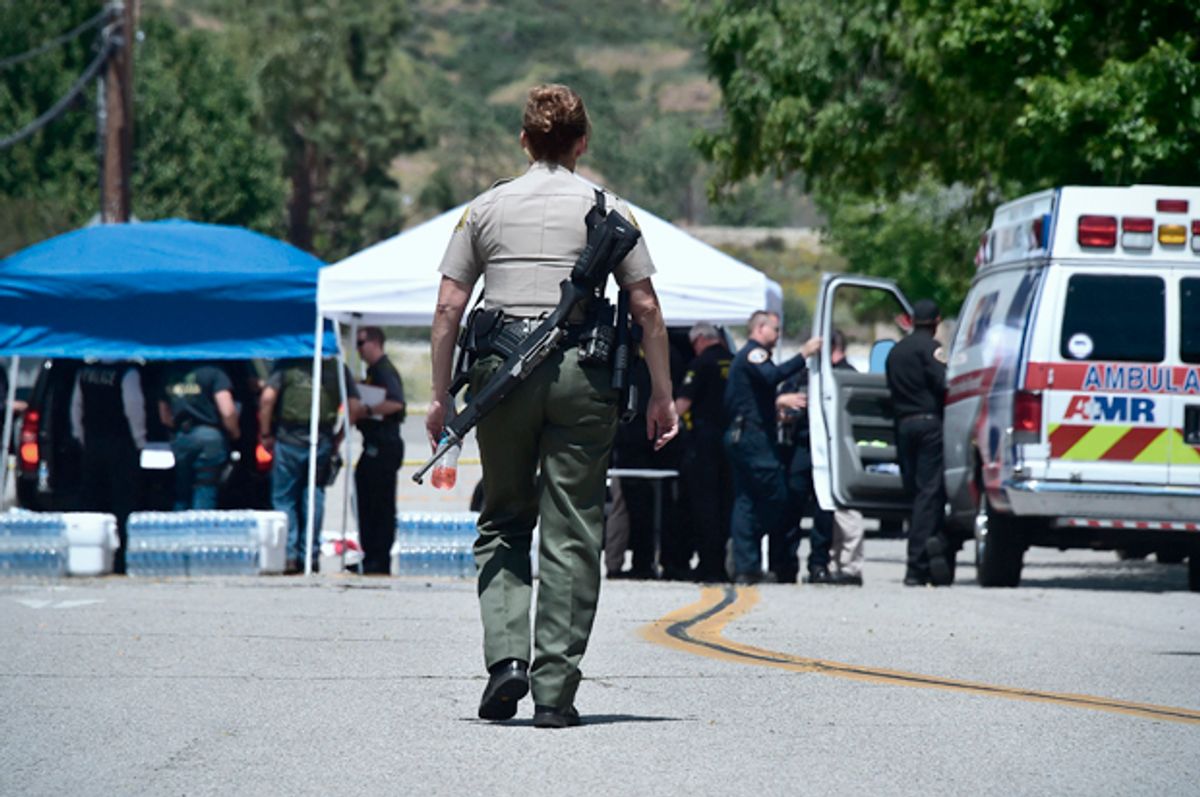 An armed law enforcement personnel in San Bernardino, California on April 10, 2017, following a school shooting.   (Getty/Frederic J. Brown)