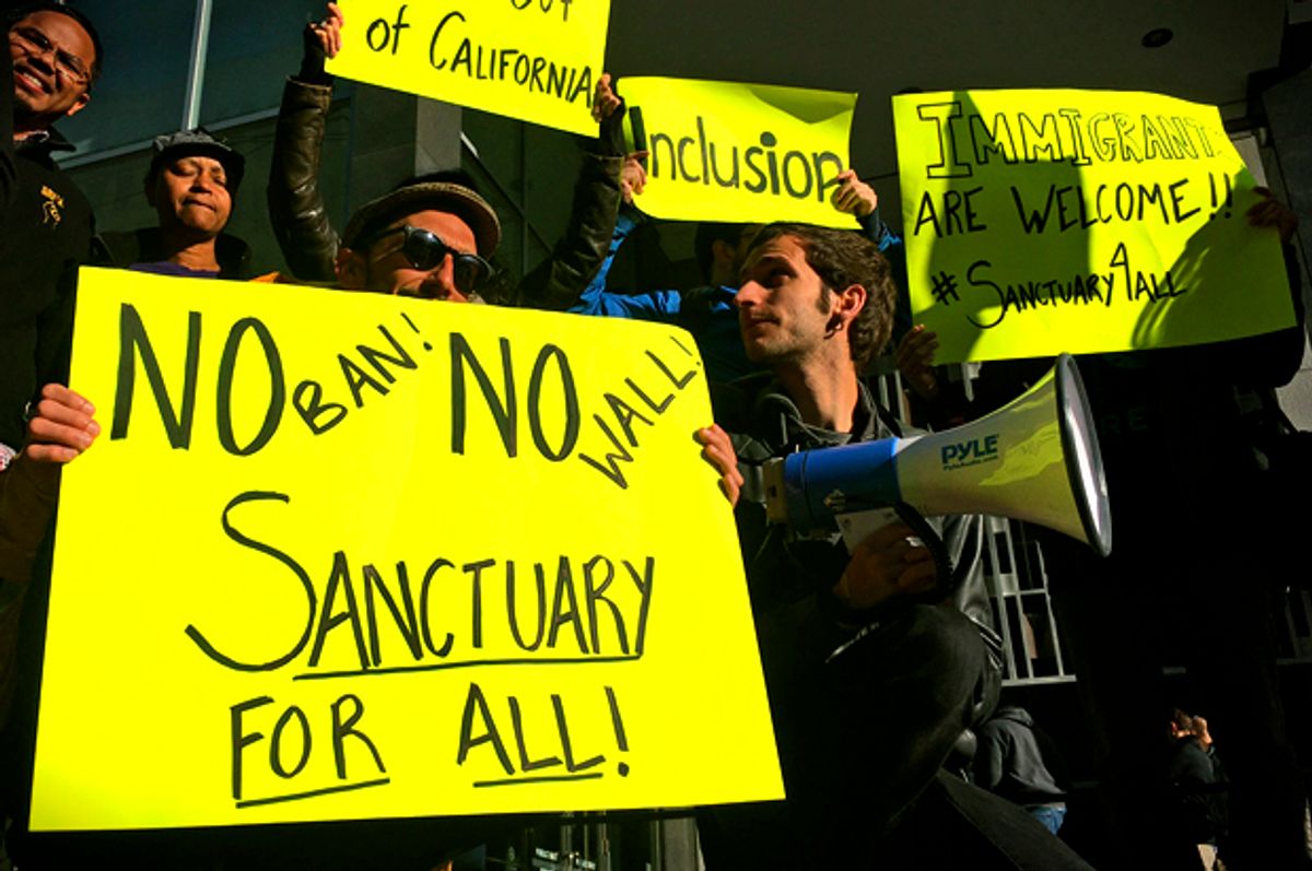 Protesters against sanctuary city crackdown   (AP Photo/Haven Daley)