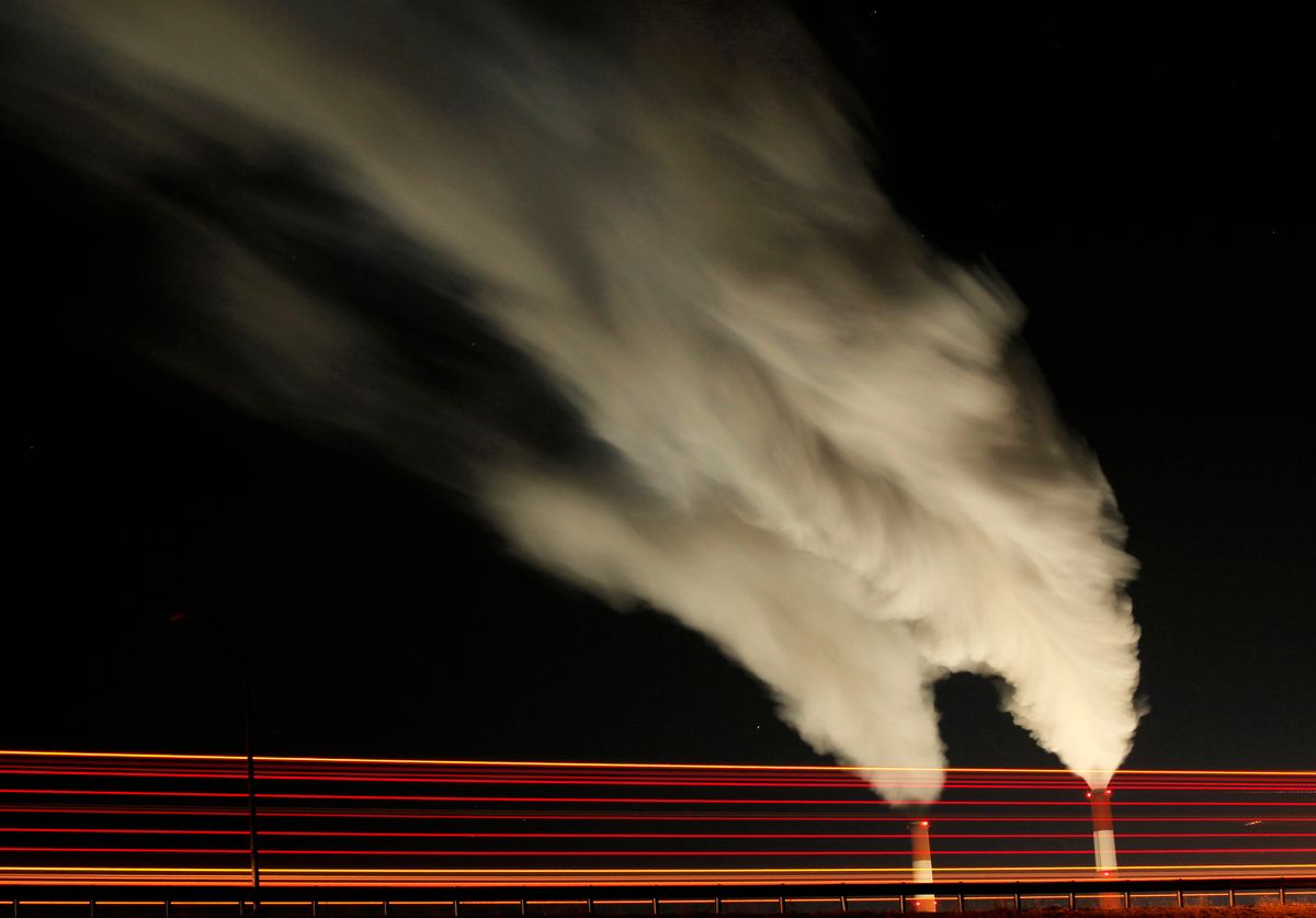 FILE - In this Jan. 19, 2012 file photo, smoke rises in this time exposure image from the stacks of the La Cygne Generating Station coal-fired power plant in La Cygne, Kan. The Environmental Protection Agency on Tuesday, April 18, 2017, asked a federal appeals court in Washington to postpone consideration of 2012 rules requiring energy companies to cut emissions of toxic chemicals. The agency said in a court filing it wants to review the restrictions, which were set to kick in next month. (AP Photo/Charlie Riedel, File) (AP)