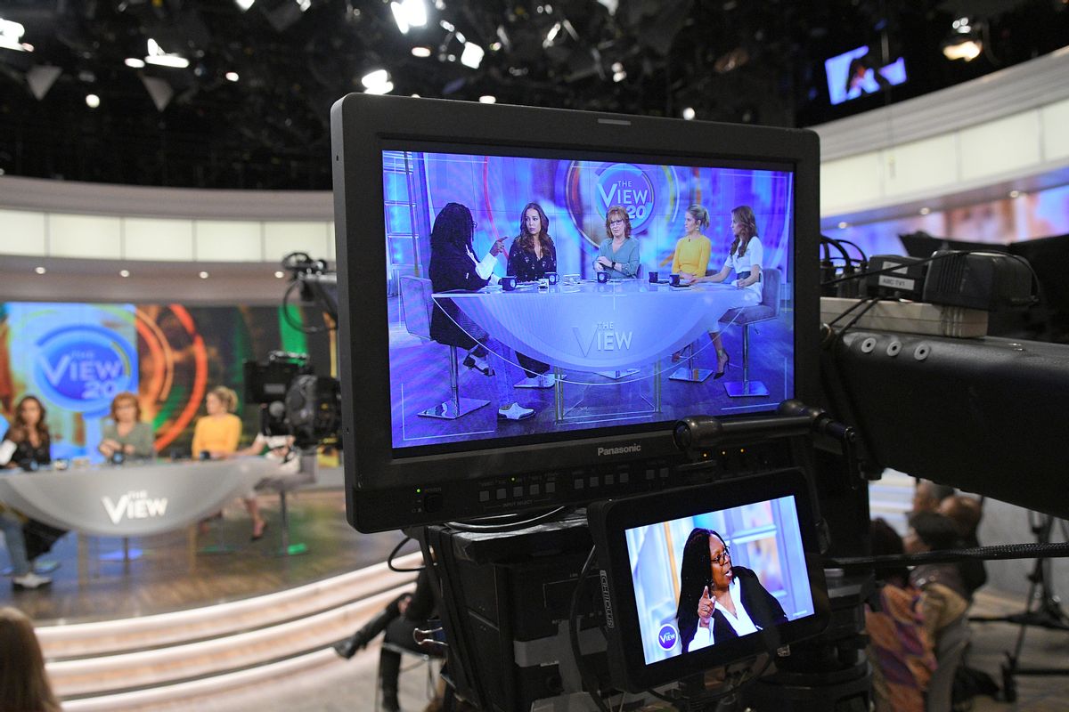 In this March 21, 2017 photo released by ABC, co-hosts, from left, Whoopi Goldberg, Sunny Hostin, Joy Behar, Sara Haines and Jedediah Bila appear on a monitor during a broadcast of "The View," in New York. The unquenchable thirst for chatter about President Donald Trump has changed the dynamics of a fierce daytime television competition much as it has in late-night TV. "The View" has spent more time talking politics with the arrival of a new administration, stopping the momentum of its rival "The Talk," which sticks to pop culture. (Lorenzo Bevilaqua/ABC via AP) (AP)