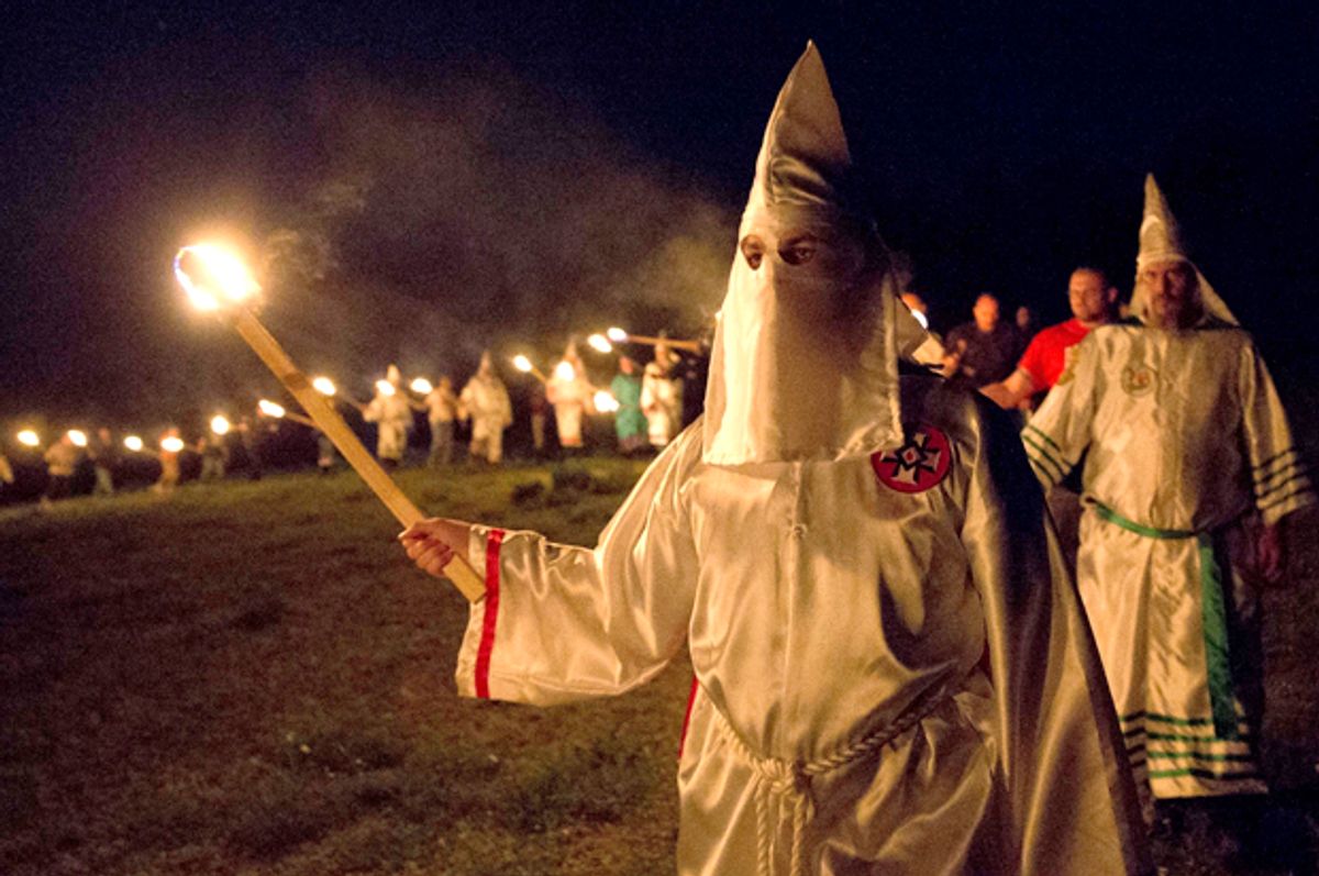 Members of the Ku Klux Klan participate in cross burnings in rural Paulding County, Ga, April 23, 2016.   (AP/John Bazemore)