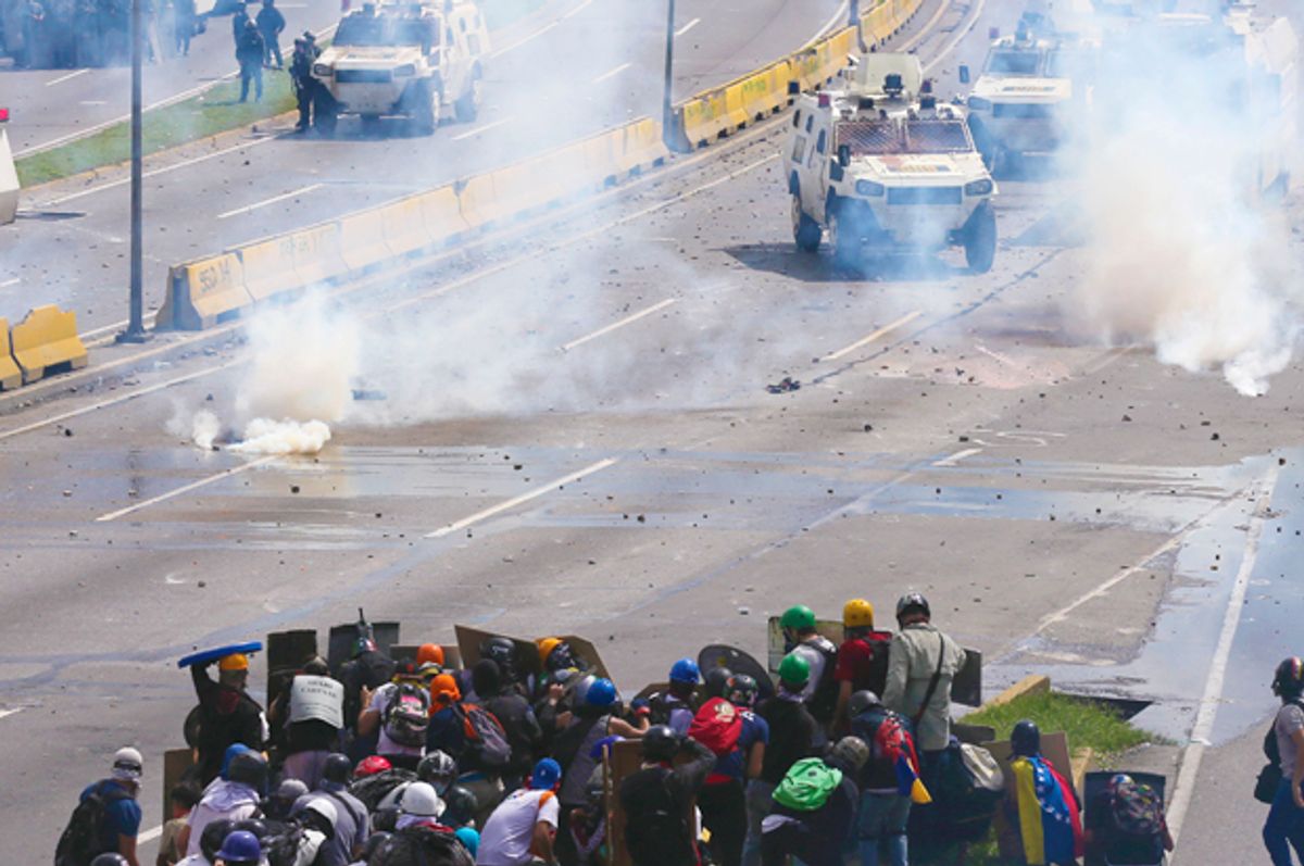 Anti-government demonstrators face off with security forces (AP/Fernando Llano)