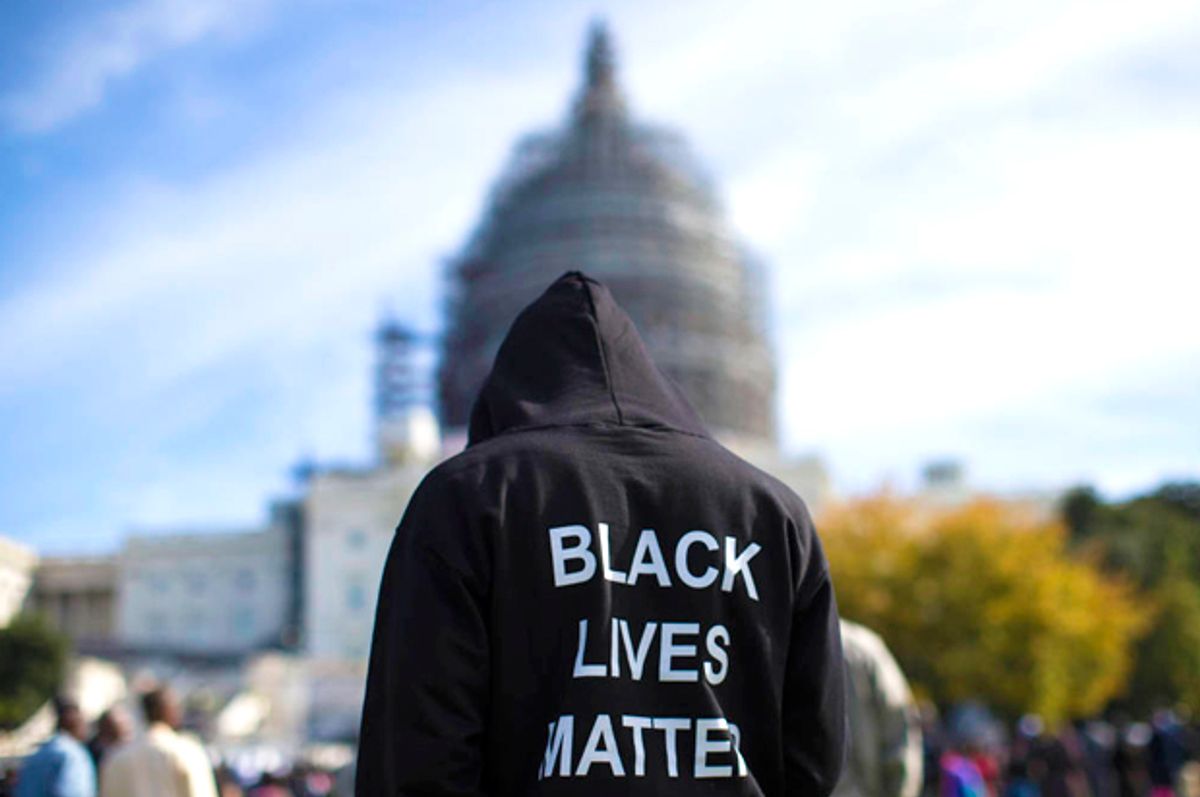 A man wears a "Black Lives Matter" hoodie as he stands on the Capitol building lawn (AP/Evan Vucci)