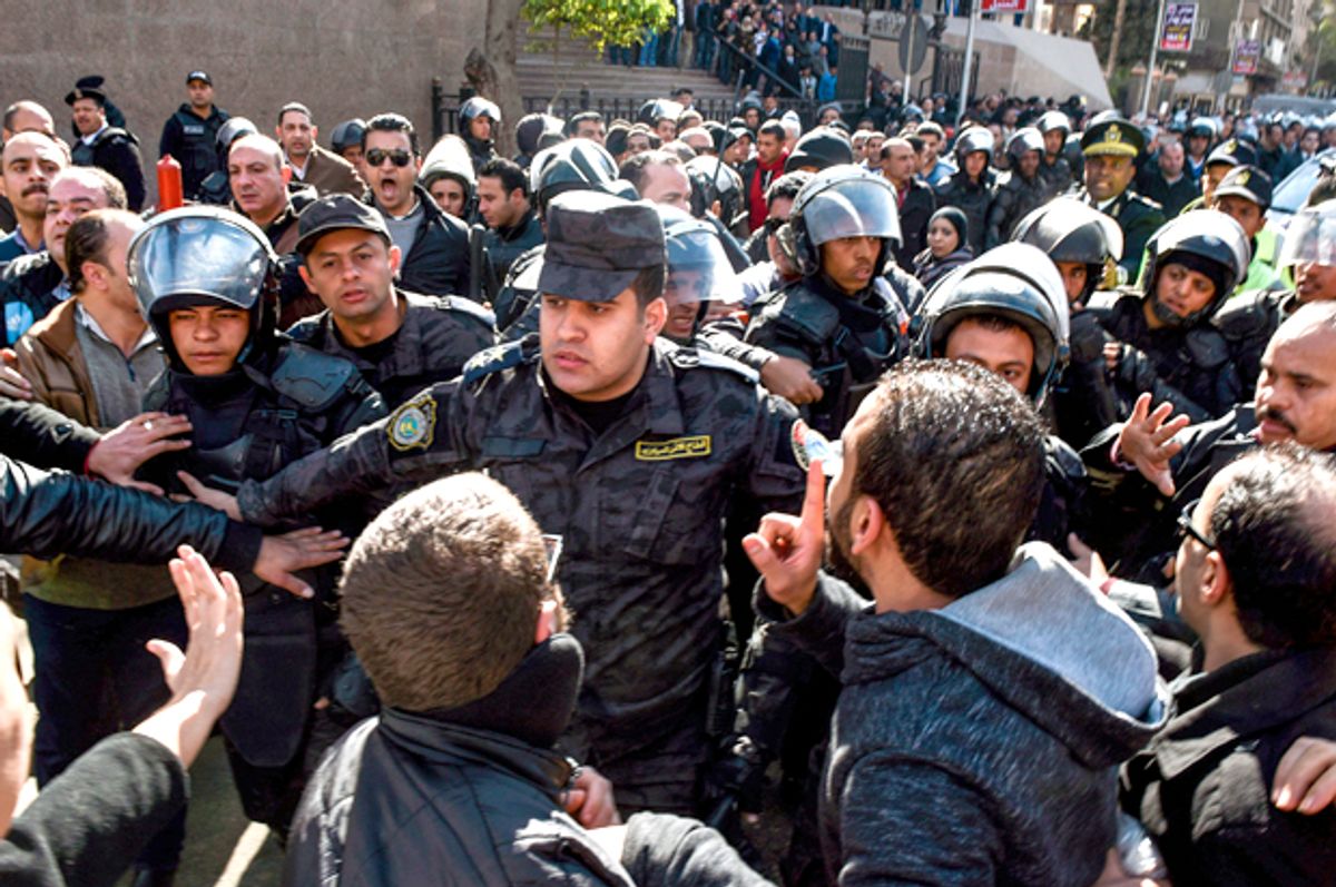 Egyptian riot policemen surround a march (Getty/Mohamed El-Shahed)