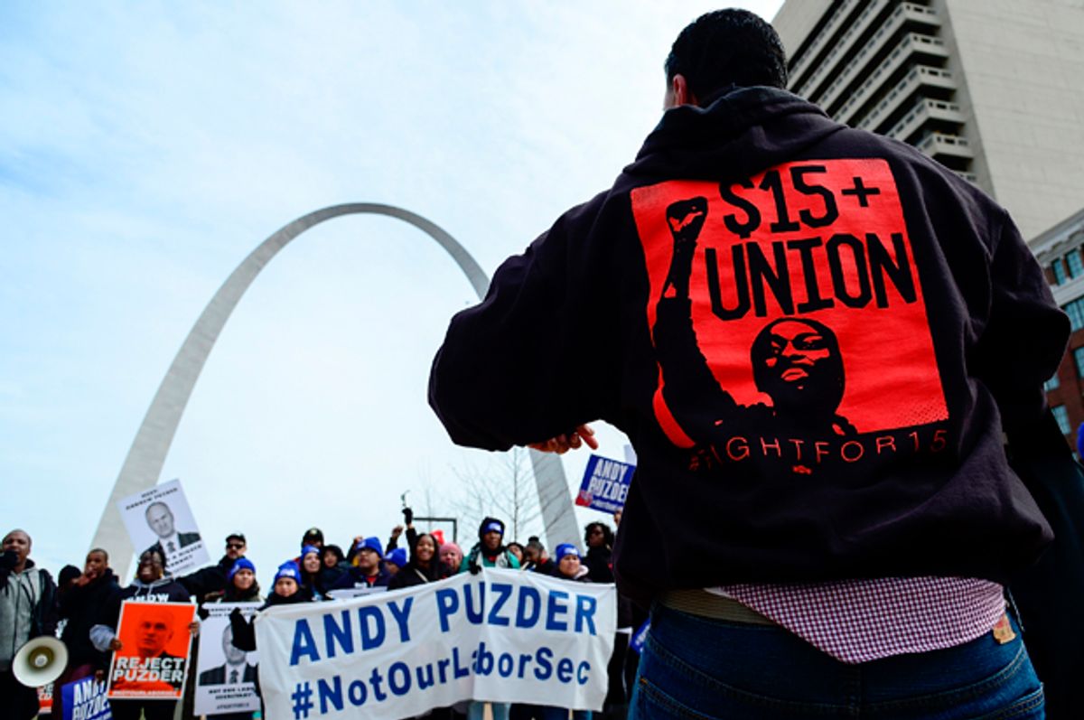 Protesters rally against Labor nominee Andrew Puzder outside of a Hardee's restaurant on February 13, 2017 in St Louis, Missouri. (Getty/Jeff Curry)