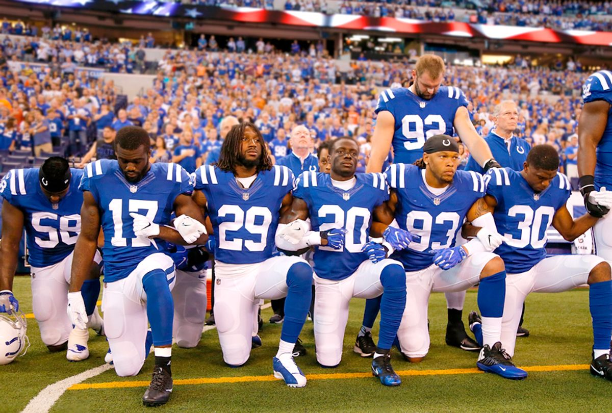 Members of the Indianapolis Colts kneel during the National Anthem, September 24, 2017 (Getty/Michael Reaves)