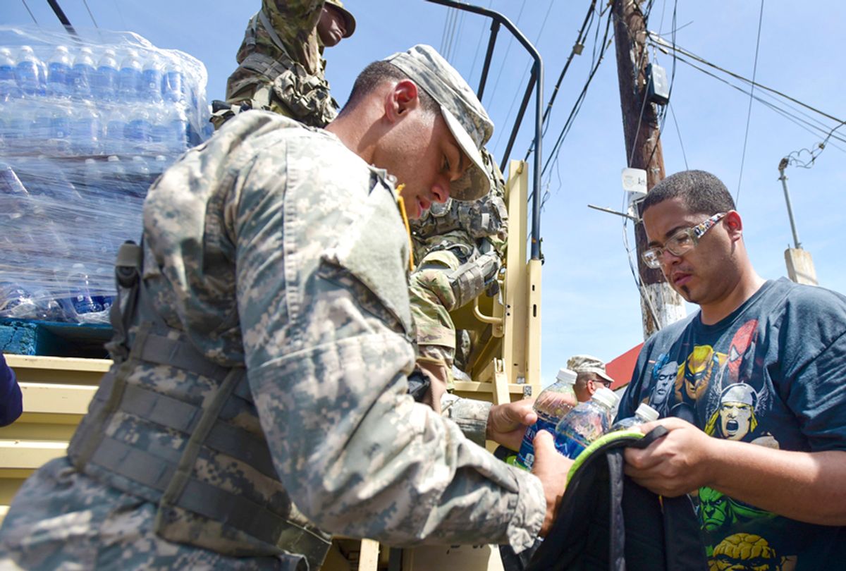 National Guardsmen distribute water and food among after Hurricane Maria in Puerto Rico (AP/Carlos Giusti)