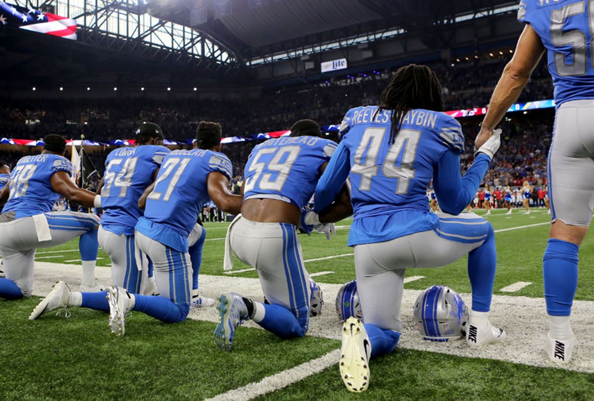 Members of  the Detroit Lions take a knee during the playing of the national anthem, September 24, 2017 (Getty/Rey Del Rio)
