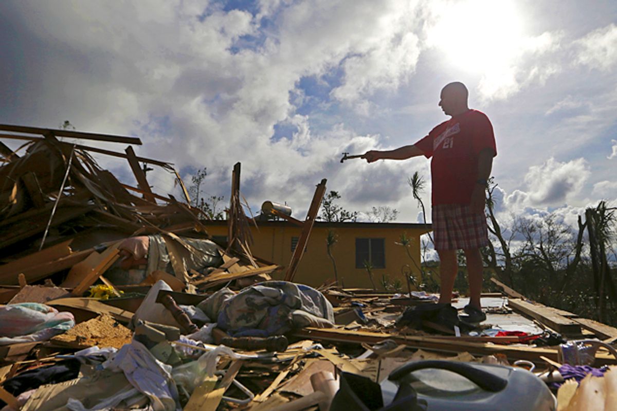 Jose Garcia Vicente holds a piece of plumbing he picked up, as he shows his destroyed home, in the aftermath of Hurricane Maria, in Aibonito, Puerto Rico, Monday, Sept. 25, 2017. The U.S. ramped up its response Monday to the humanitarian crisis in Puerto Rico while the Trump administration sought to blunt criticism that its response to Hurricane Maria has fallen short of it efforts in Texas and Florida after the recent hurricanes there. (AP Photo/Gerald Herbert) (AP)