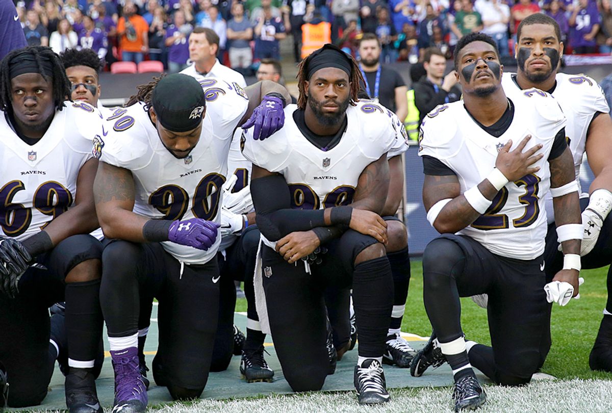 Baltimore Ravens players kneel during the playing of the U.S. national anthem, Sunday Sept. 24, 2017 (AP/Matt Dunham)