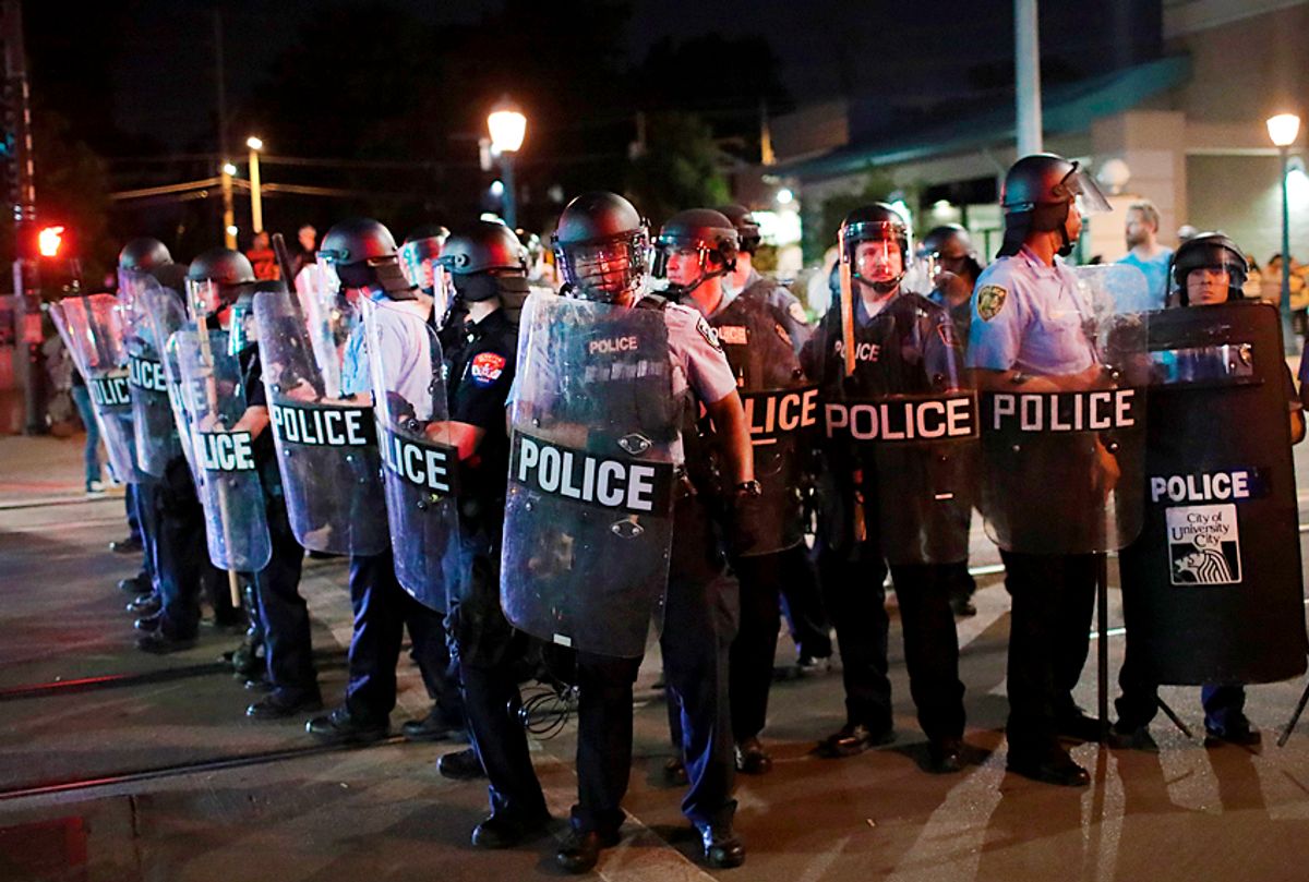 Police confront demonstrators. (Getty/Scott Olson)